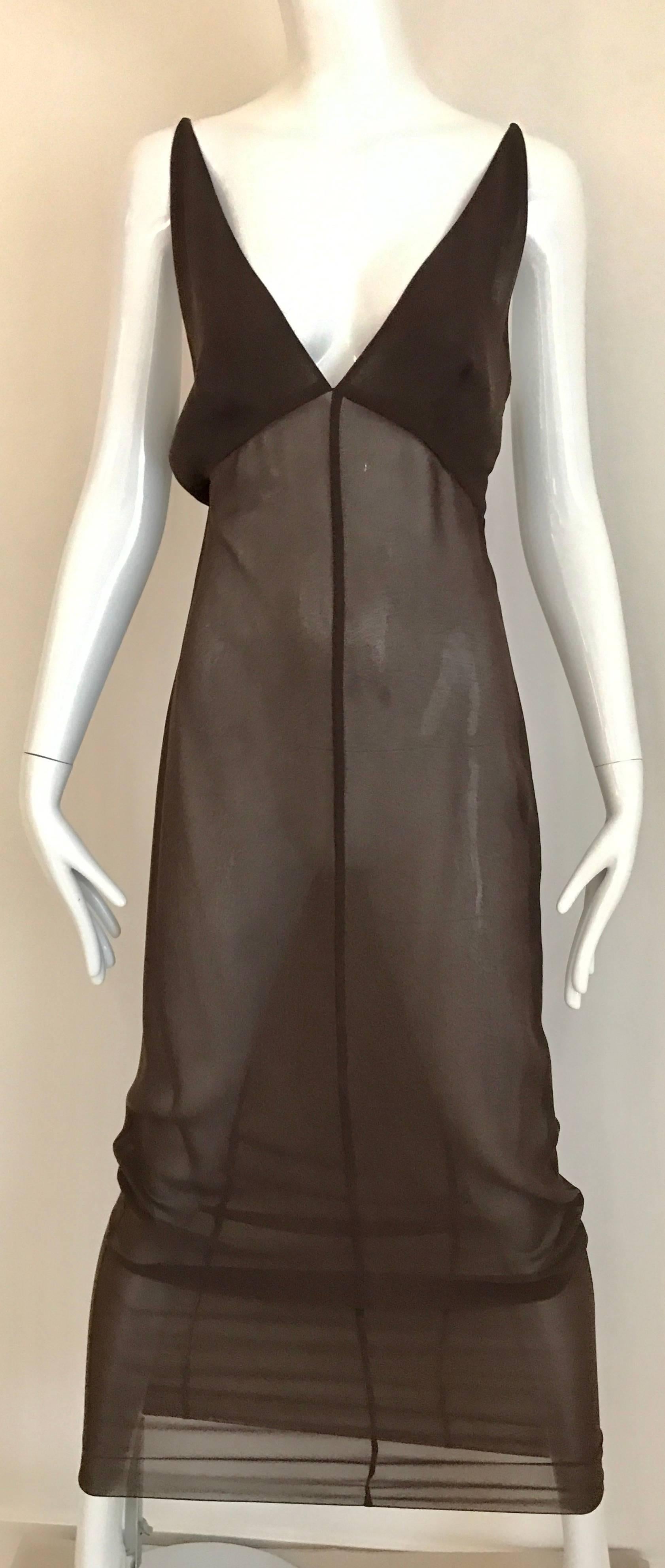 Very Unusual Vintage CHANEL Crepe Spaghetti Strap V neck  dress with sleeveless long Vest. This ensemble can be worn so many ways. ( see images provided)
Dress measurement Bust 32-34 inch / Waist 30 inch/ Hip 34 inch/Length 58inch
Long Vest : 34
