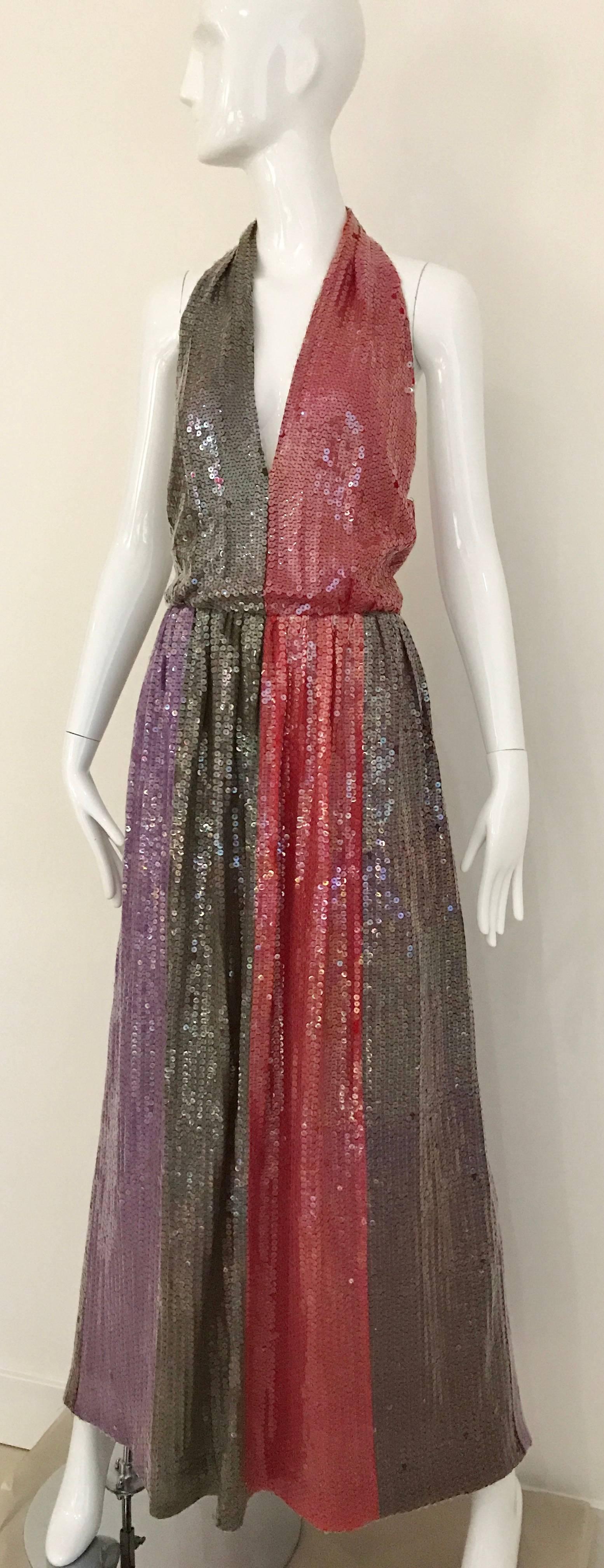 Sexy Vintage 70s BILL BLASS Red, Purple and stone brown clea sequin V neck Halter gown with exposed bare back. Perfect for holiday event. Judith Lieber Star belt available for purchase at my 1stdibs store. 
Size MEDIUM - LARGE 
Bust: 38 inch /