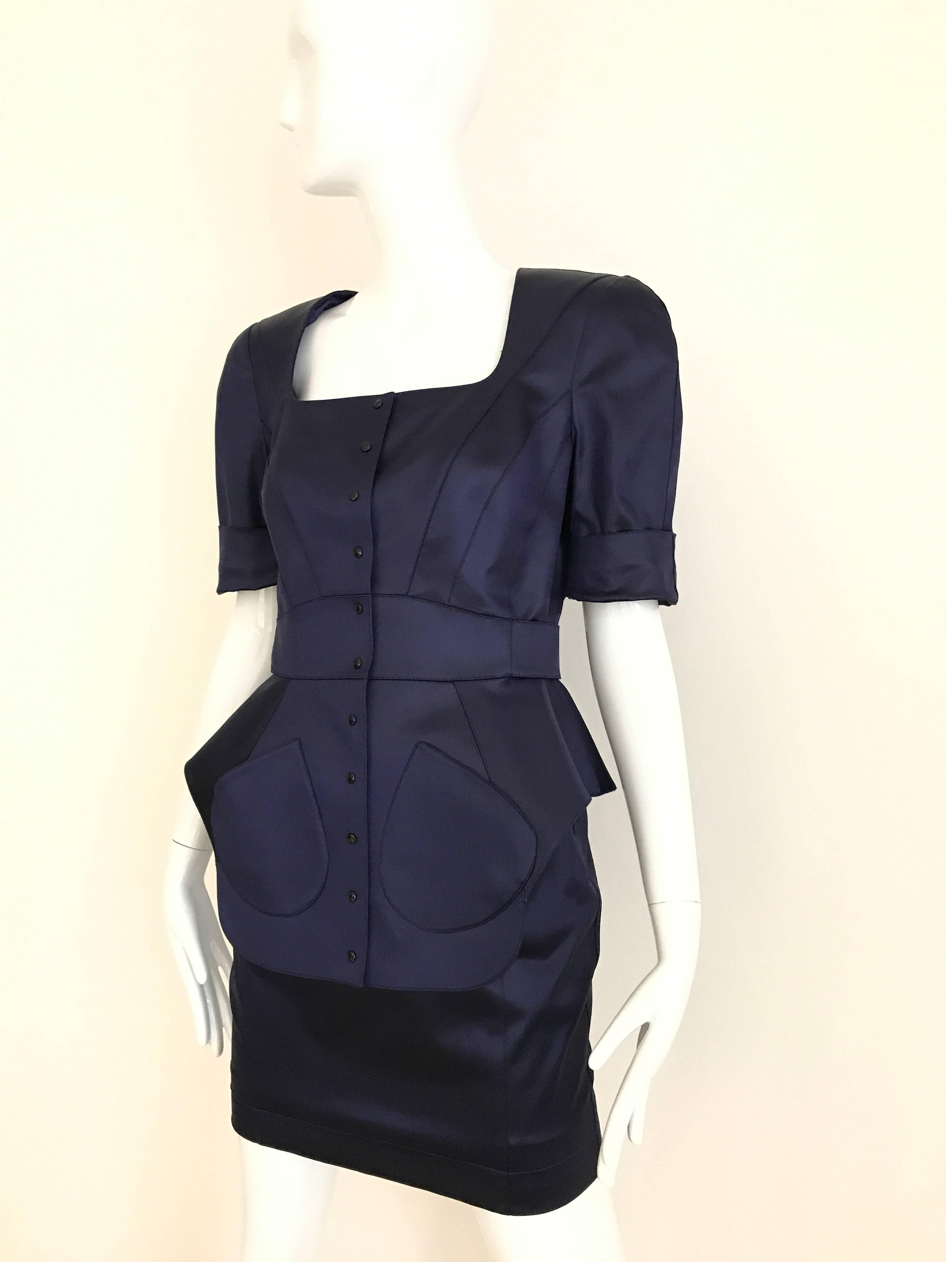 1980s Vintage THIERRY MUGLER Blue Satin Fitted peplum Jacket and Skirt ensemble .
Fitted Jacket with soft shoulder pad and square neck. Snap buttons and bow at the back. Form fitting pencil skirt. 
Fit Medium 4/6
Jacket measurement: Bust: 36 inch/