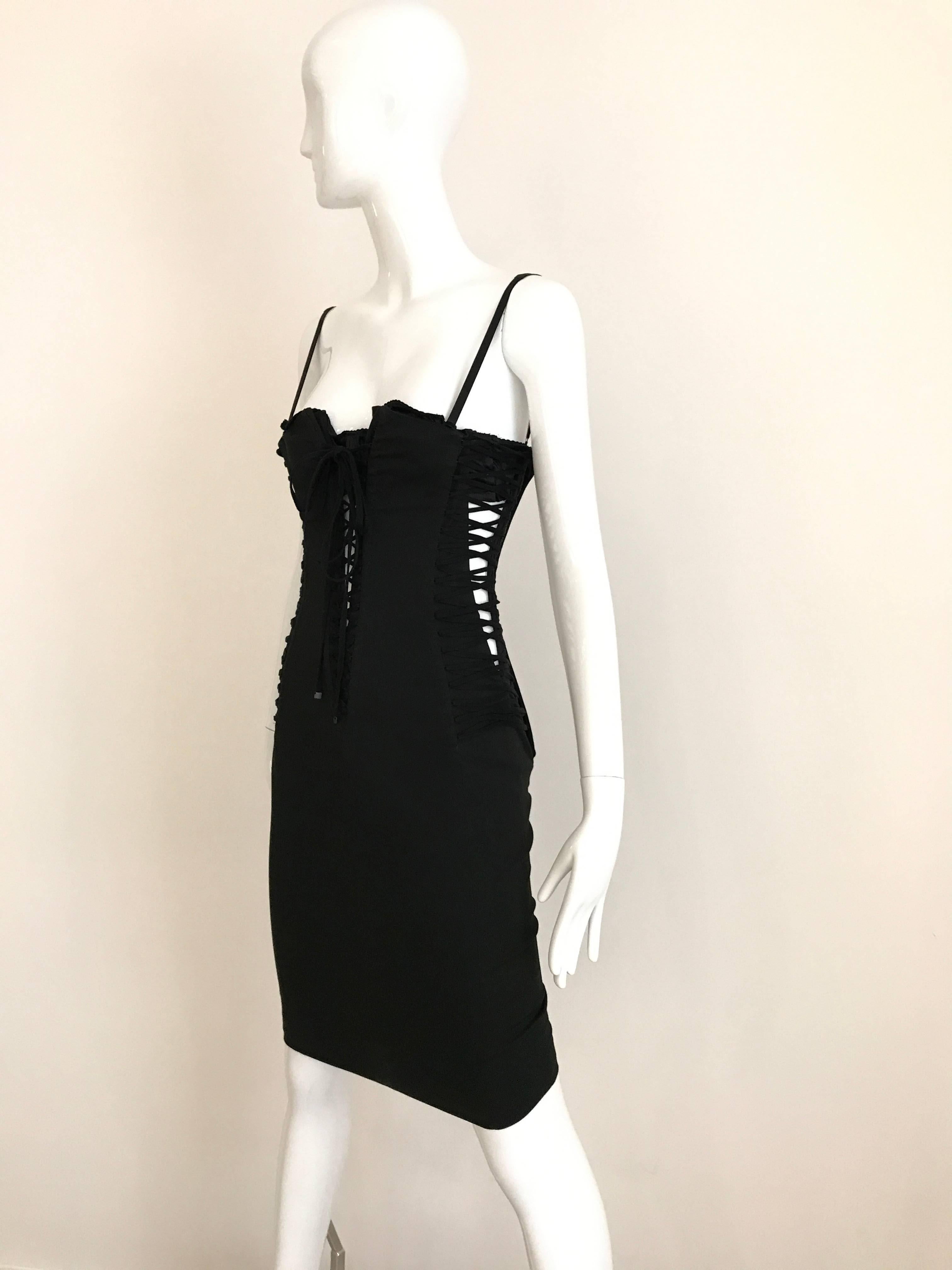 Early 2000s Classic Dolce Gabanna Black Cotton lace up sexy Bustier dress with bra .  
Dress has little bit stretch. Peek a boo both side and front lace. Dress has invisible zipper on the side.
Marked size 40 but it fit US 0/2
Bust: Stretch to 32