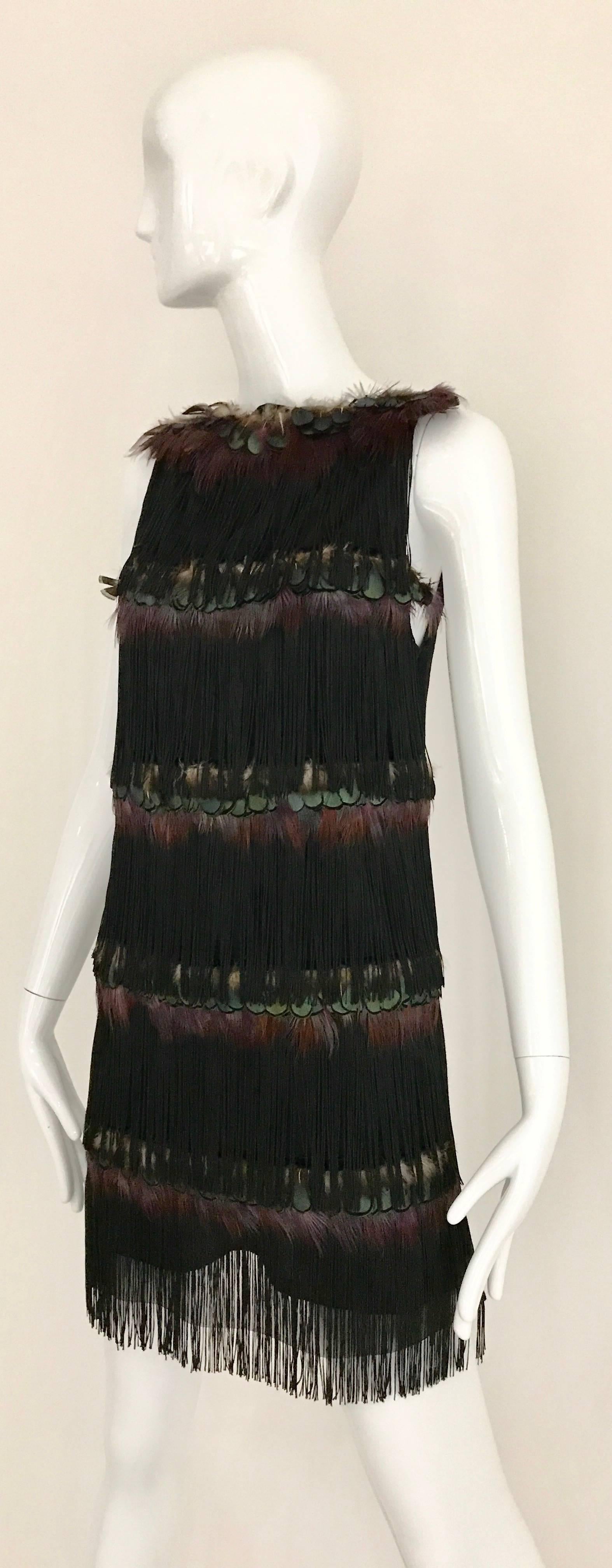 What a fun party Dress from alessandro dell'acqua. Black Dress with Feather peacocks and silk fringe tassel . Zip at the back. 
Size : Small
Bust 34 inch / Waist 30 inch / Hip 32 inch / Length 33.5 inch
**** This Garment has been professionally Dry