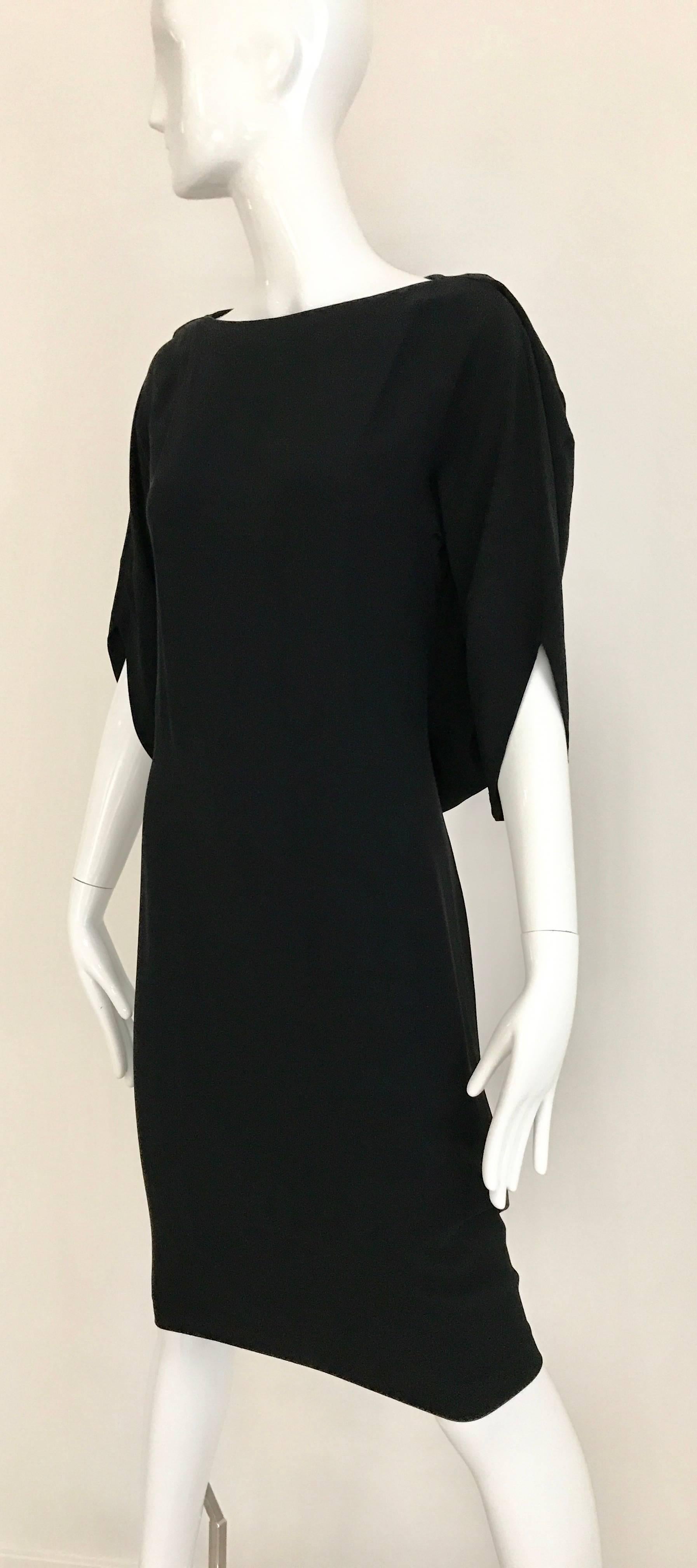 Vintage Margiela Black Rayon dress with interesting sleeves. 
Marked size 40
Bust: 34 inch / Waist 26 inch - 32 inch / hip 36 inch / Dress Length: 43 inch
