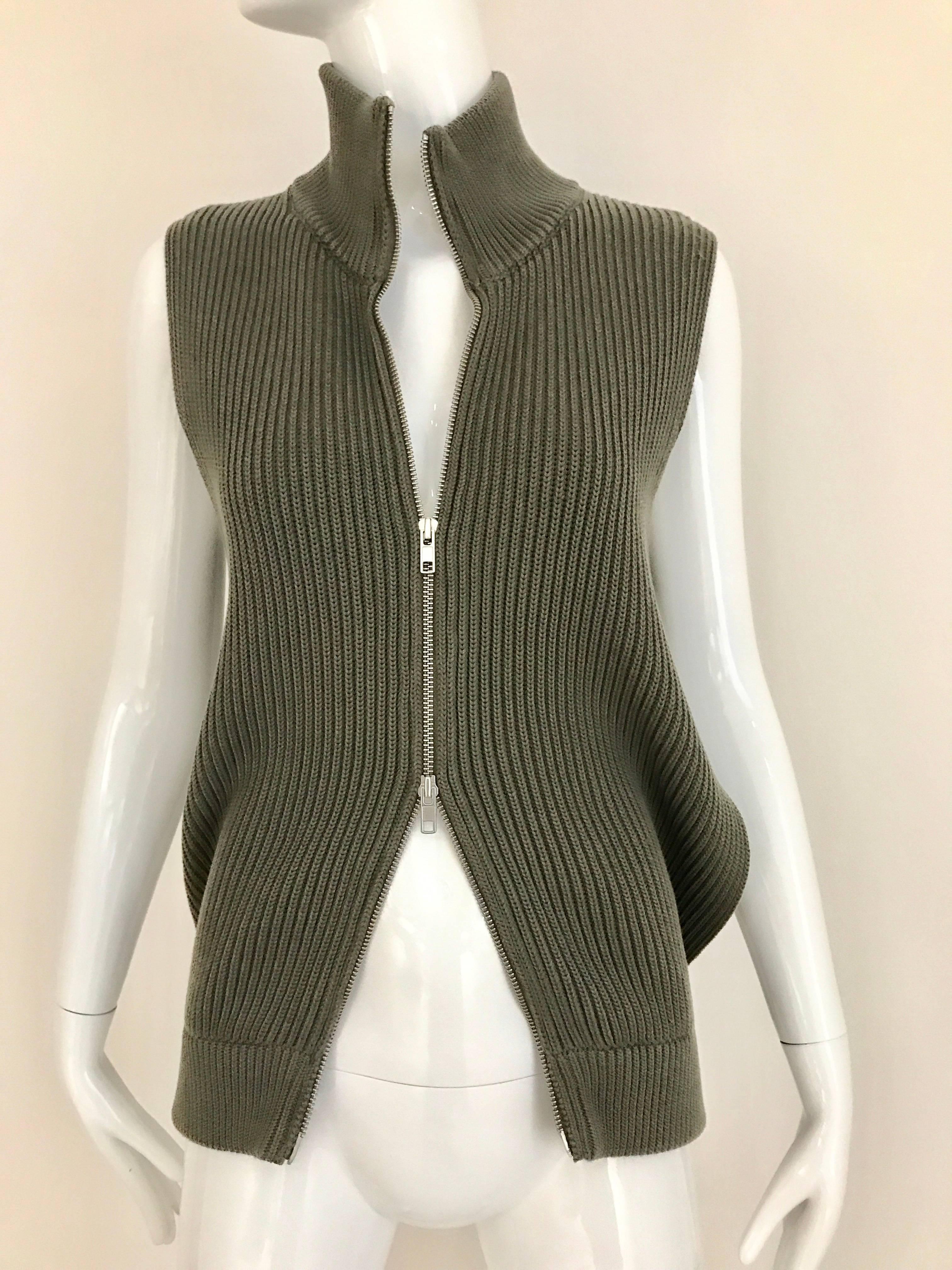 Margiela olive green vest cardigan knit top with double zipper in the front and cut out from the side. 
Bust: 34 inch - 36 inch unzipped
Waist: 30 inch / Vest  front Length: 24 inch - back length 26 inch
