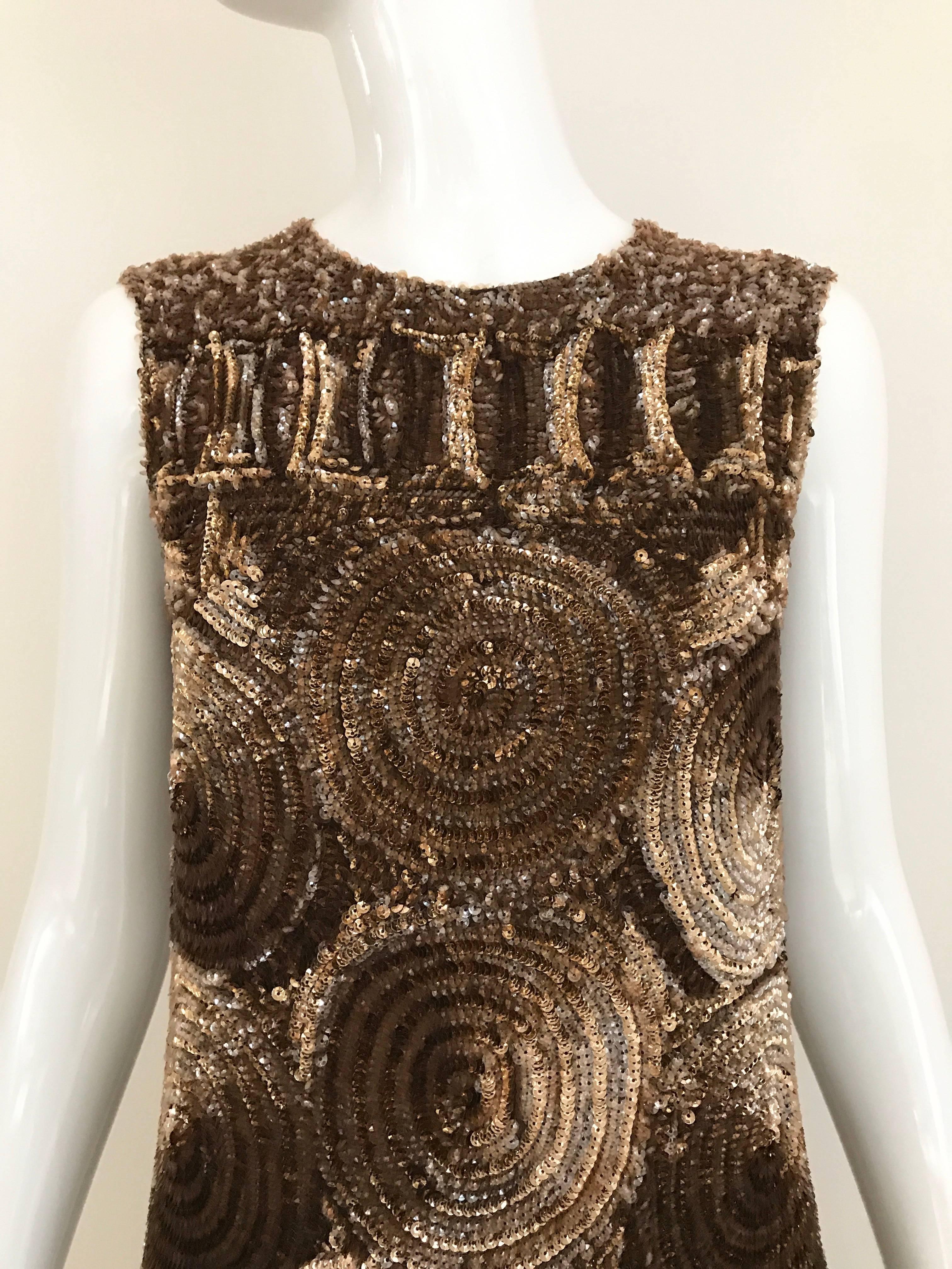 Timeless 1960s Bronze Sequin sleeveless cocktail sequin maxi dress. Perfect for black tie or evening cocktail Party.
Bust: 34 inches
Hip: 36 inches