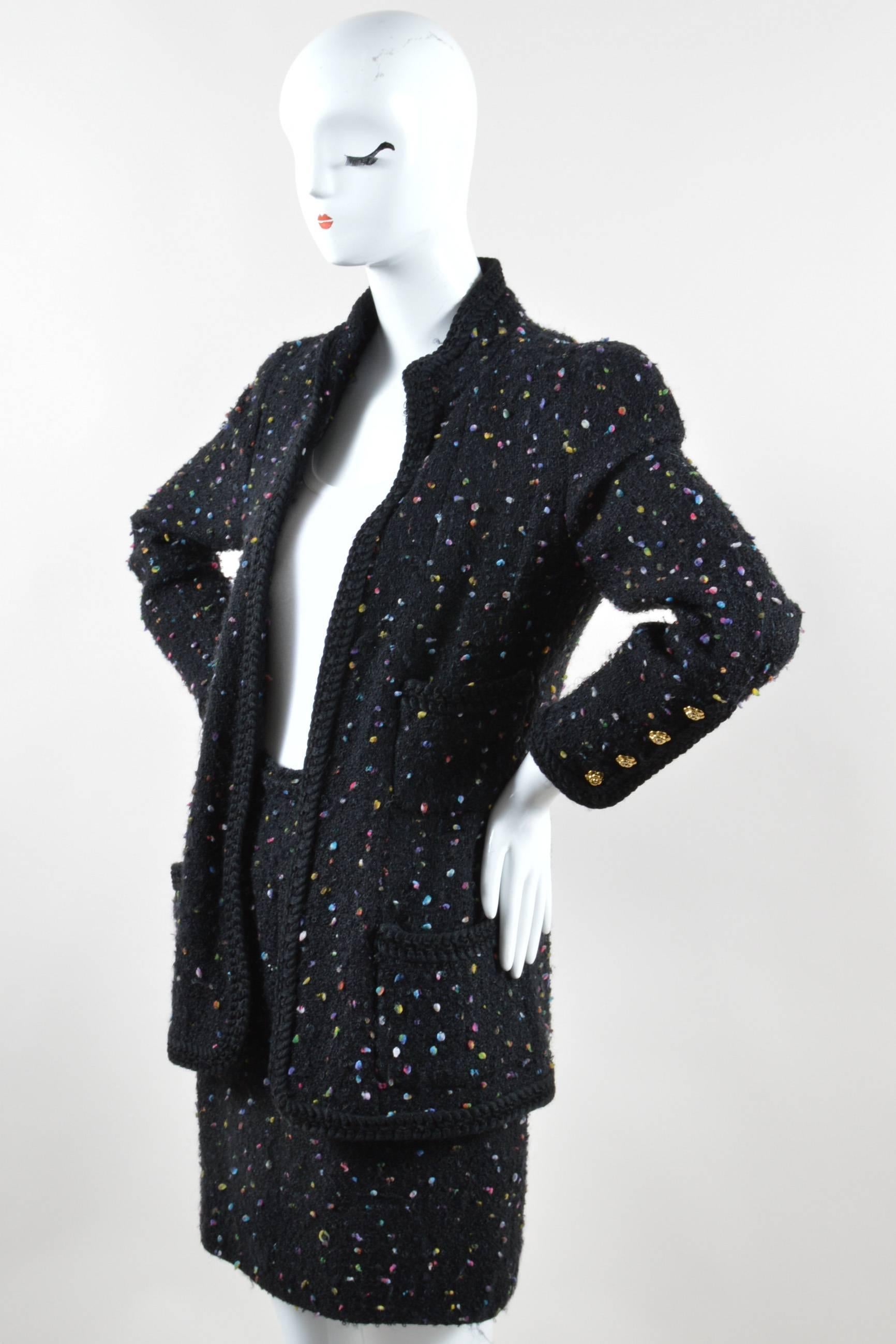 Chic suit that can be worn together or separate. Speckled multicolor applique embellishment. Jacket: High collar. Hits at hips. Woven trim. Front patch pockets. Padded shoulders. Embellished camellia buttons. Button closure at bottom of sleeves.
