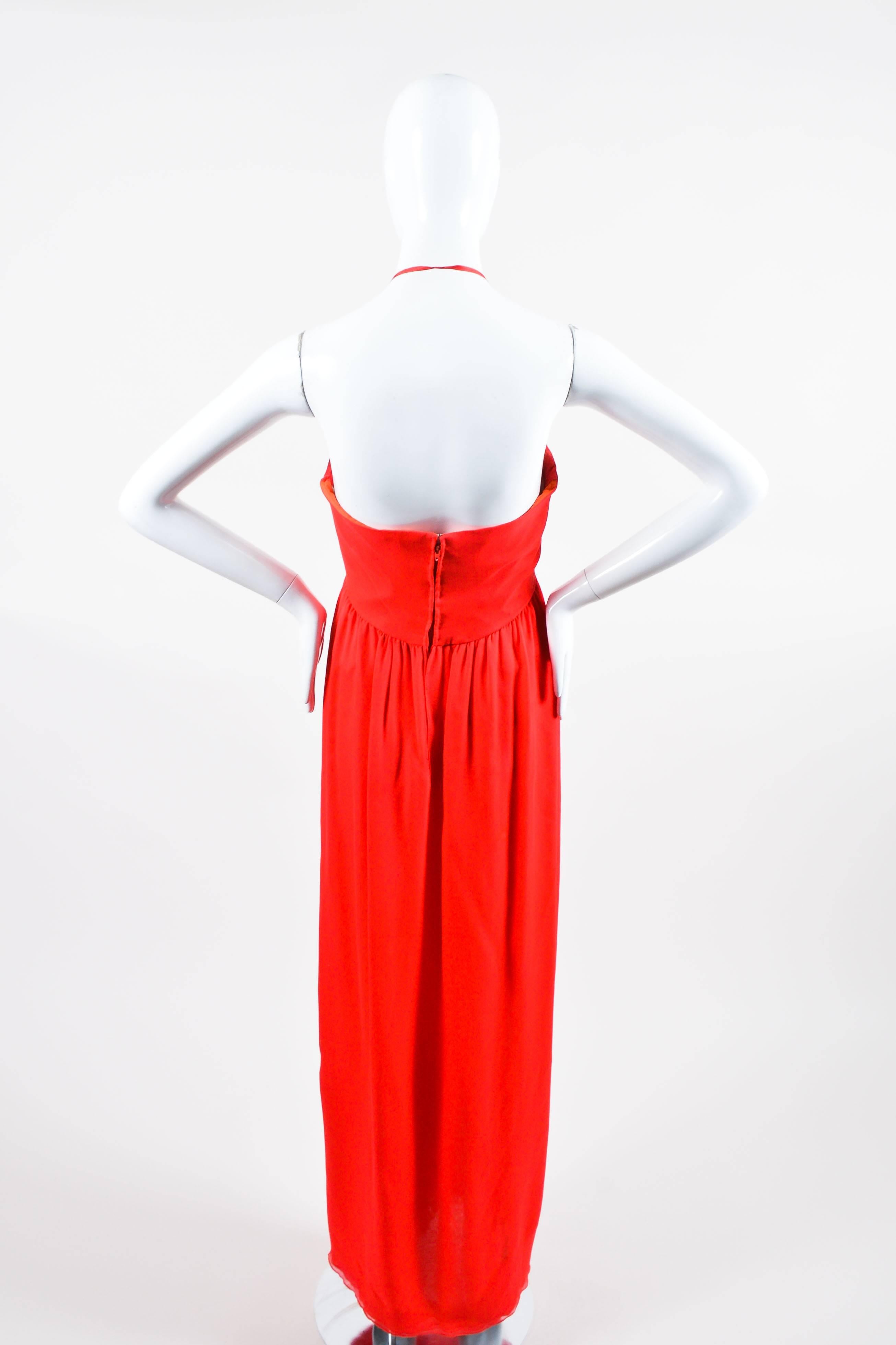 Be the 'lady in red' at your next event in this elegant, strapless gown. Constructed of light, ethereal silk. Tailored bodice features a built-in bustier with vertical boning and lightly padded cups. High waistline. Floaty skirt flares away from
