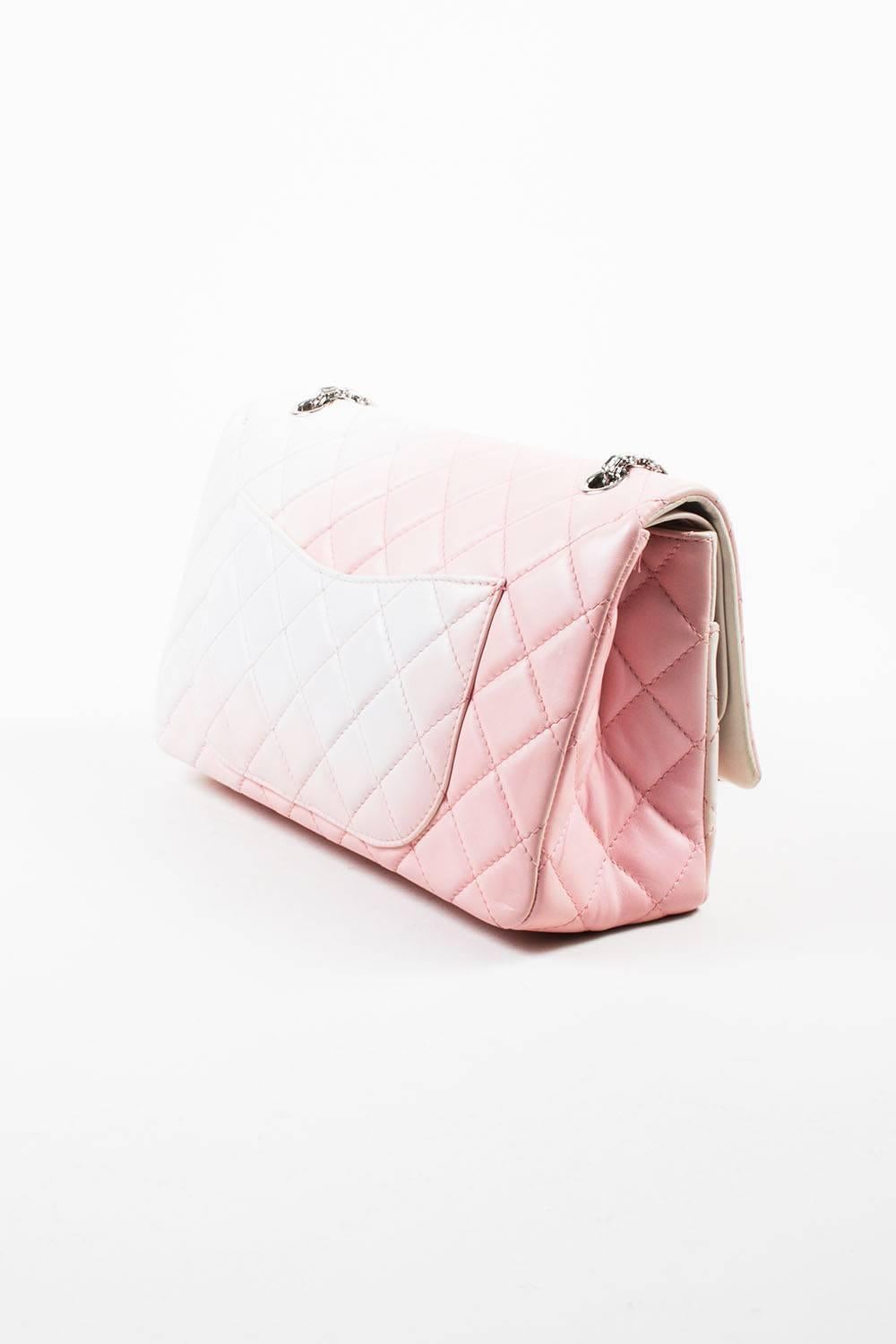 This pastel colored "2.55 Reissue 227" bag oozes classic Chanel with a unique feminine twist. From the spring 2009 collection. Buttery soft lightly padded lambskin leather. Ombre color pattern. Diamond quilted stitching throughout.