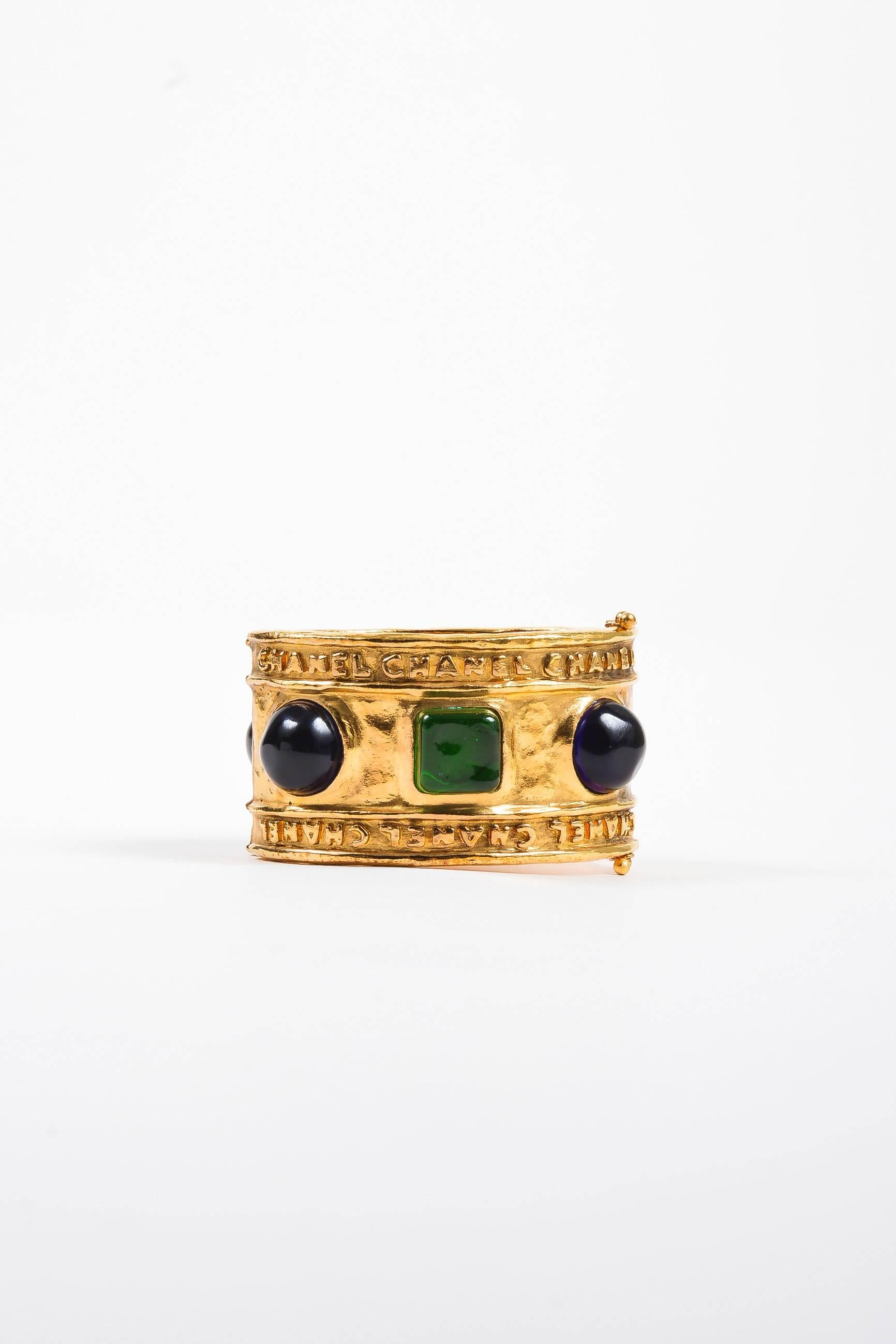 Vintage Chanel Gold Tone Hammered Blue Green Stone Embellished Cuff Bracelet In Good Condition For Sale In Chicago, IL