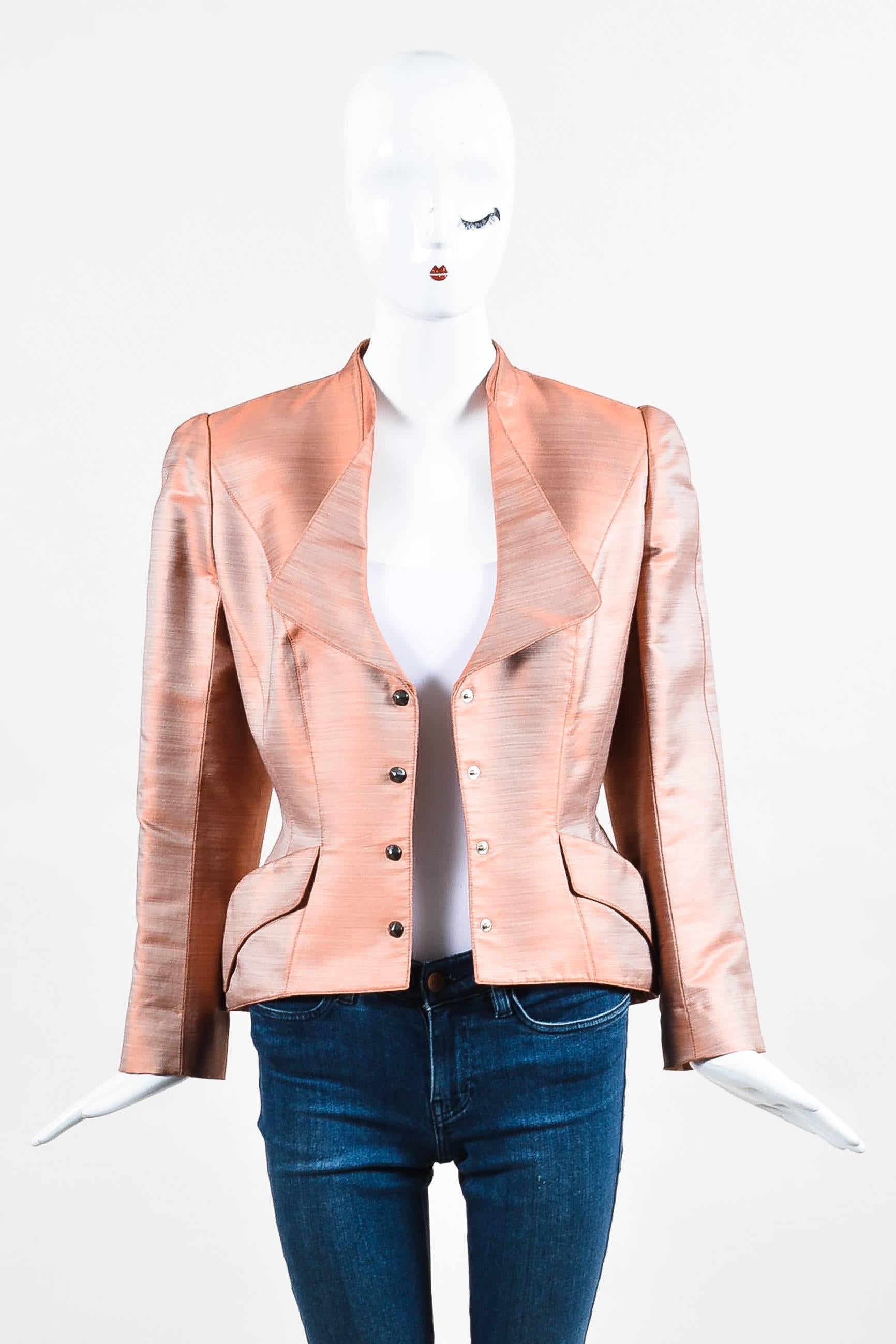 Parisian-chic blazer featuring structured shoulders, round pyramid stud snap-buttons down the center front, a high-low, peplum hem, diagonal flap pockets, and an ornamental collar. Lined.

Size:	
44 (FR)
12 (US)	

Additional Measurements: