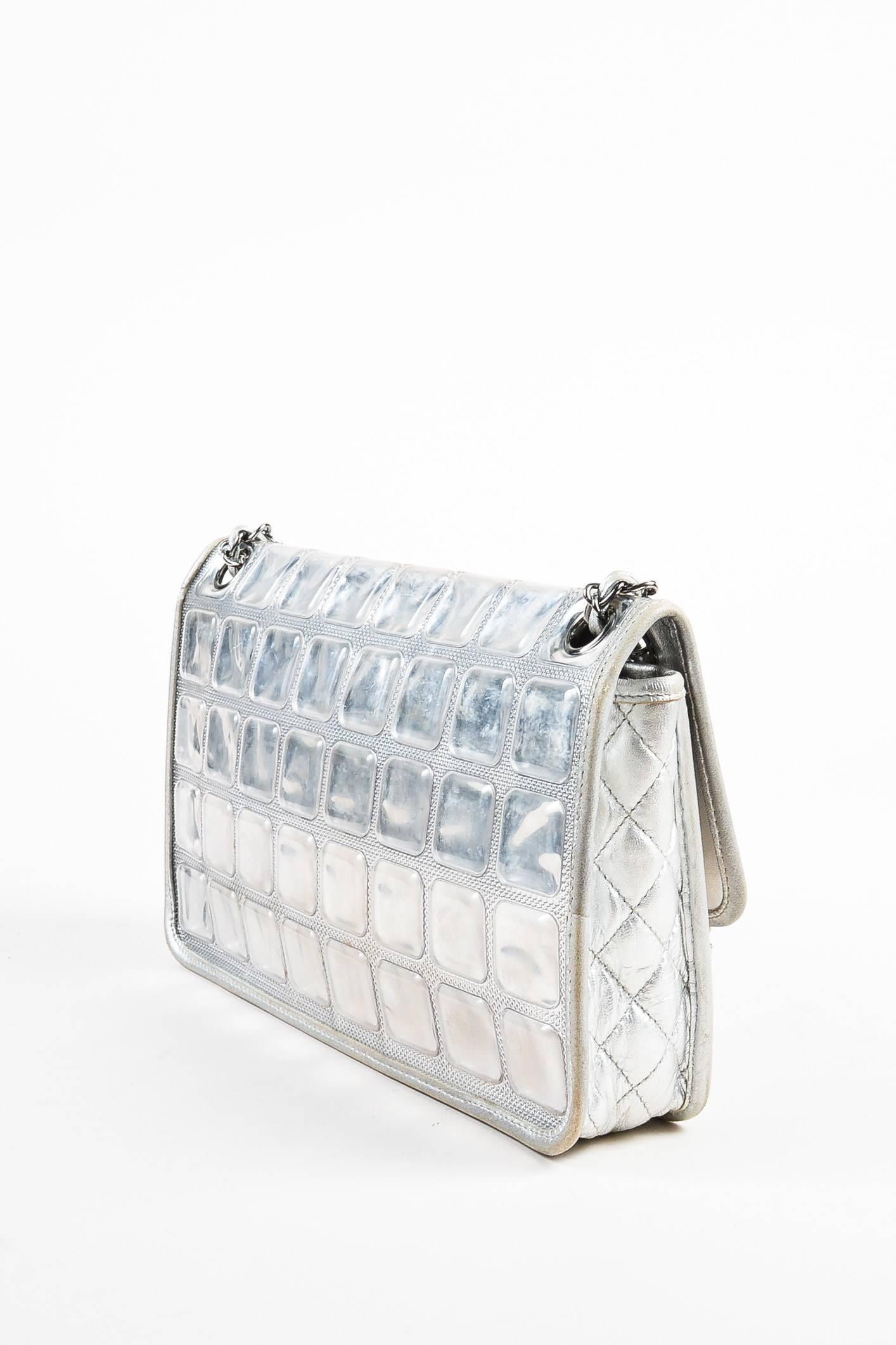 2006/2008-era "Ice Cube" bag. Celebrity favorite as seen on Kim Kardashian. Statement bag for a chic daytime affair or an evening night out. Italian handcrafted construction. Metallic leather with ice cube shaped vinyl coated textile