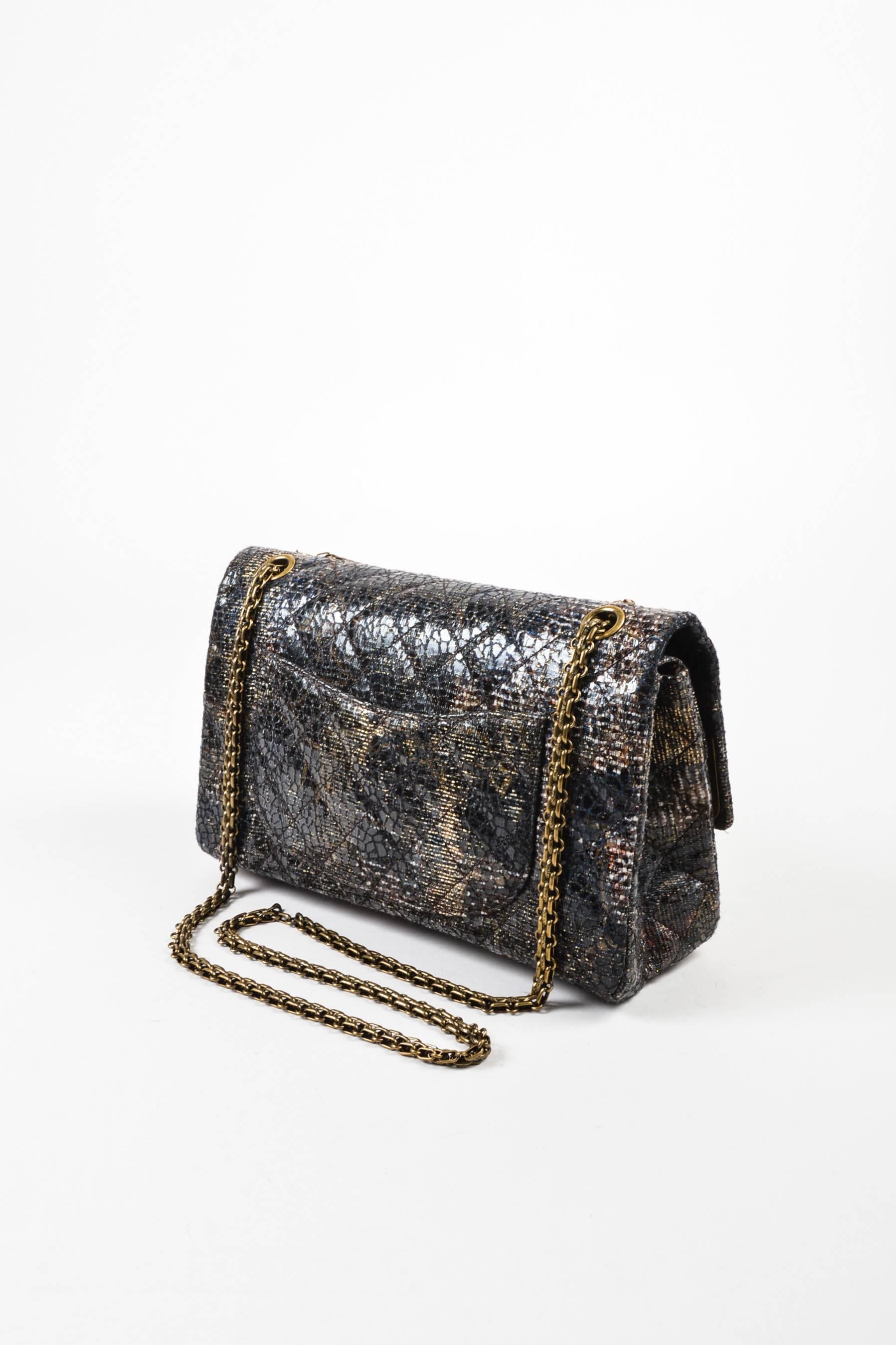 Special edition gray and brown lacquered tweed bag from Chanel's Paris-Shanghai Runway Collection circa 2009-2010. Gold chain strap that cab be doubled or worn as a single crossbody strap. Open pocket on back of bag. Mademoiselle turn lock on front