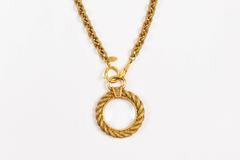 Vintage Chanel Gold Tone Etched Link Chain Magnifying Glass Pendant Necklace