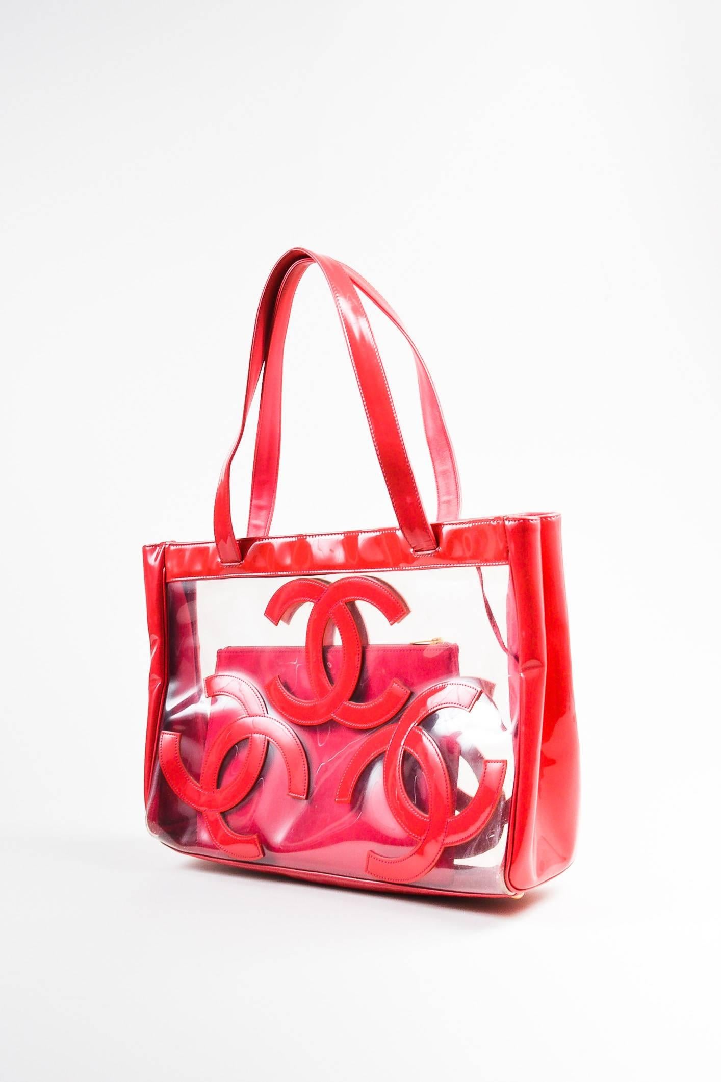 Released circa 2004-2005. A must-have beach accessory in a lighthearted hue, this tote features interlocking 'CC' panels on a transparent background, dual flat straps, an east-west silhouette, and a footed seat. Snap closure concealed at the