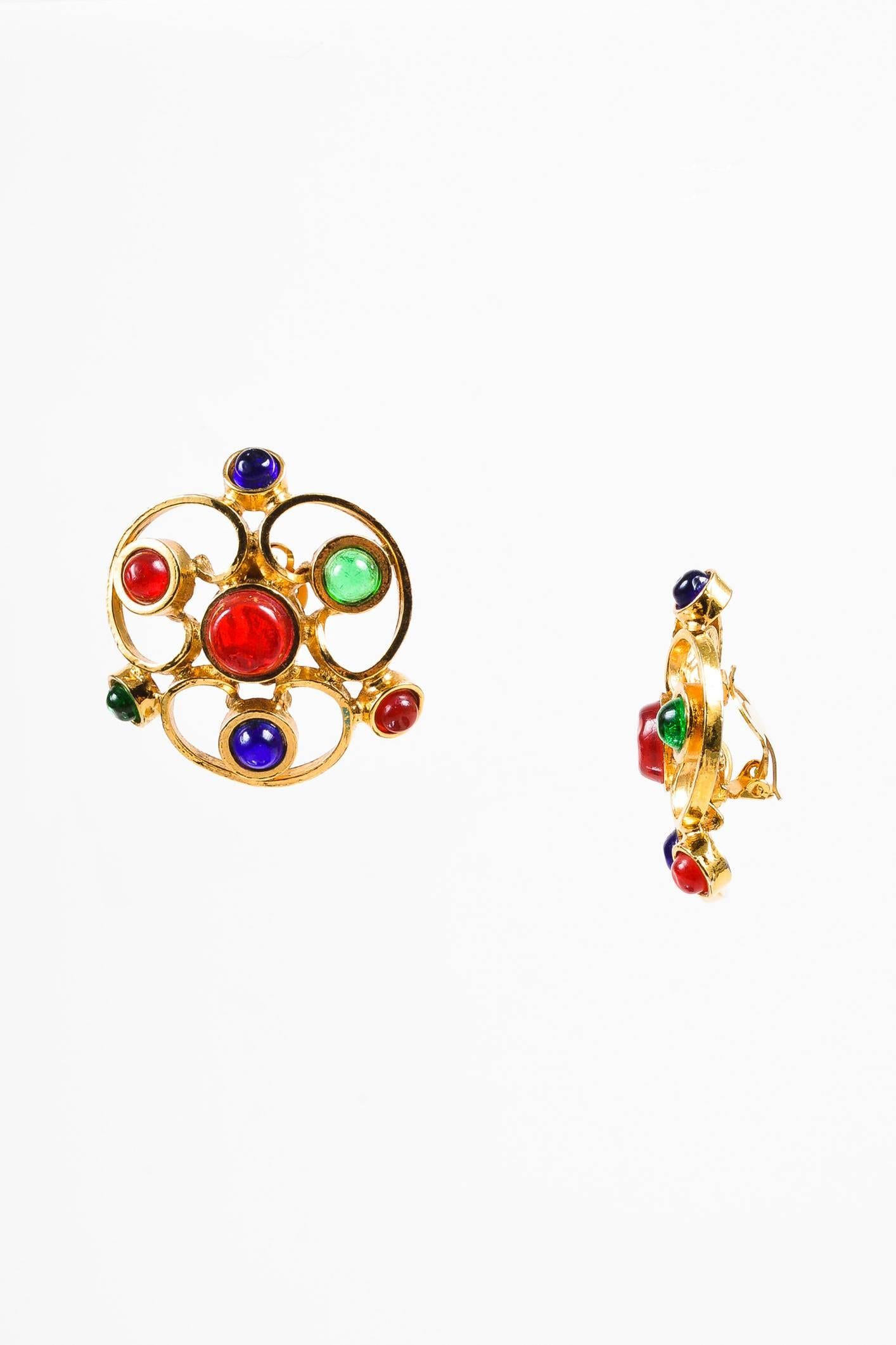 A piece of iconography, this artfully designed earring is detailed with multicolored Gripoix glass stones set in a gold-tone metal. Clip-on back. Pair with a one-shoulder dress to complete the look.

Condition:
Pre-owned. This item is in good