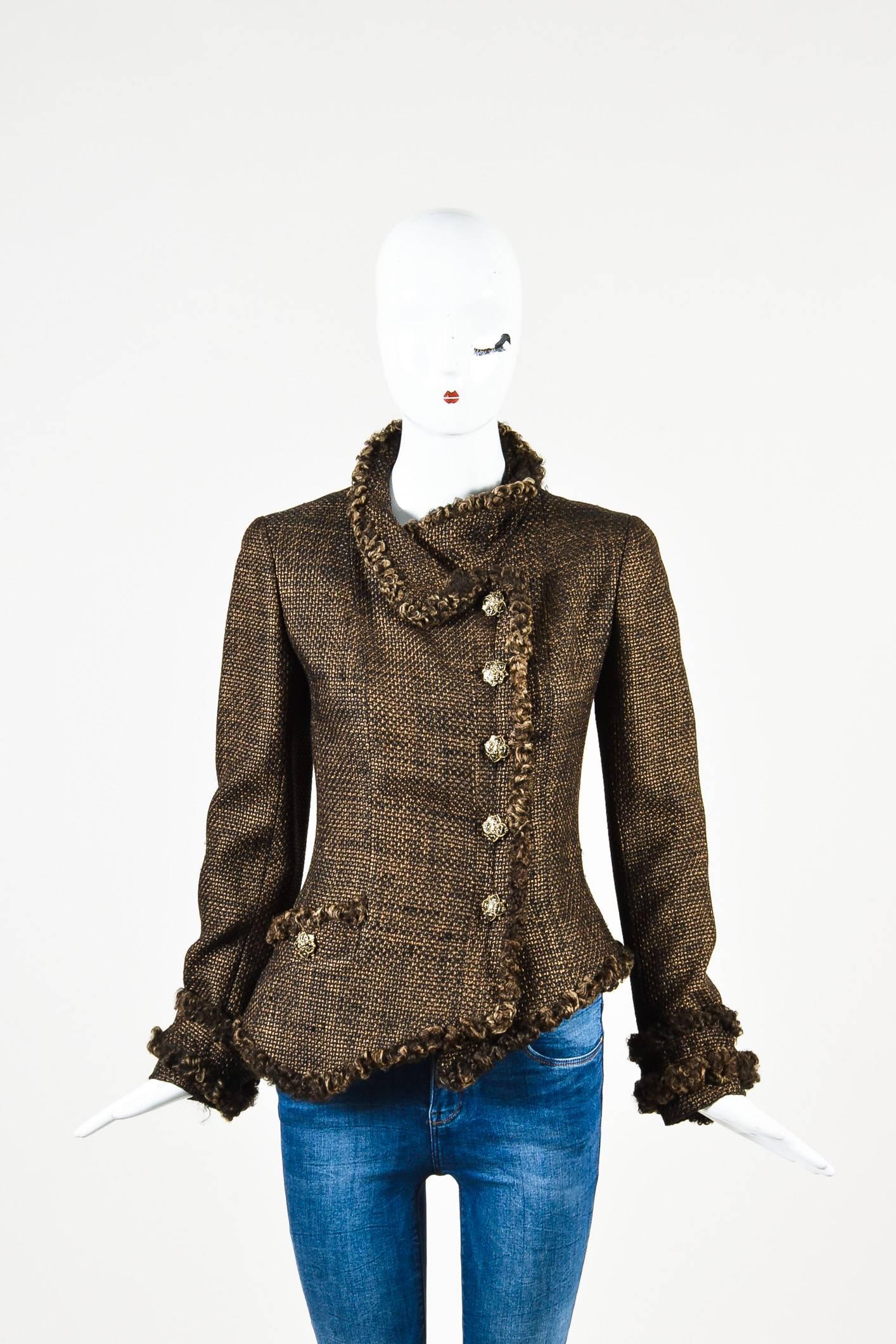 Exude classic Chanel sophistication in this jacket from the fall 2009 Russian collection. Woolen textile construction. Tweed weaving with metallic threading throughout. Soft curly lamb fur trimmings. Gold-tone embellished buttons with enamel