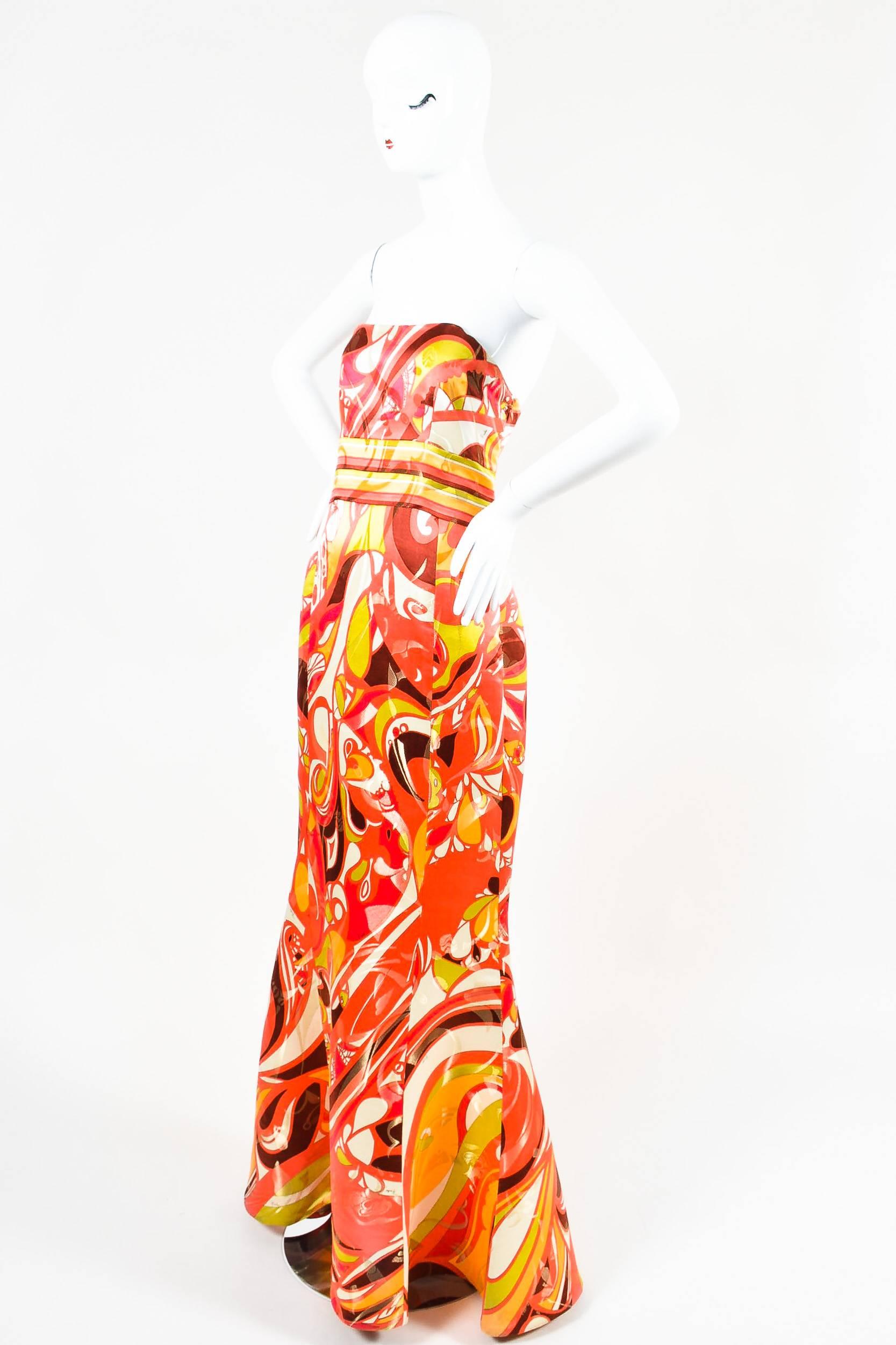 Emilio Pucci multicolor empire waist gown featuring the brand's signature abstract print with gold metallic brocade finishing throughout. Hidden zip closure. Strapless. Unlined.

Size:
10 (US), 42 (F), 40 (D), 44 (I)