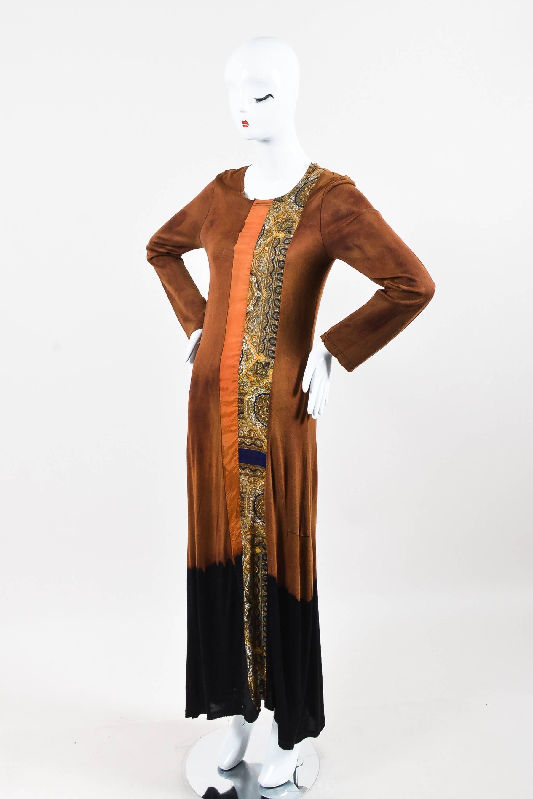 Tan maxi dress. Faded look with black dip dyed bottom. Burnt orange and paisley multicolor trim. Unfinished edges. Long sleeves. Scoop neckline.

Additional measurements: Sleeve Length 26