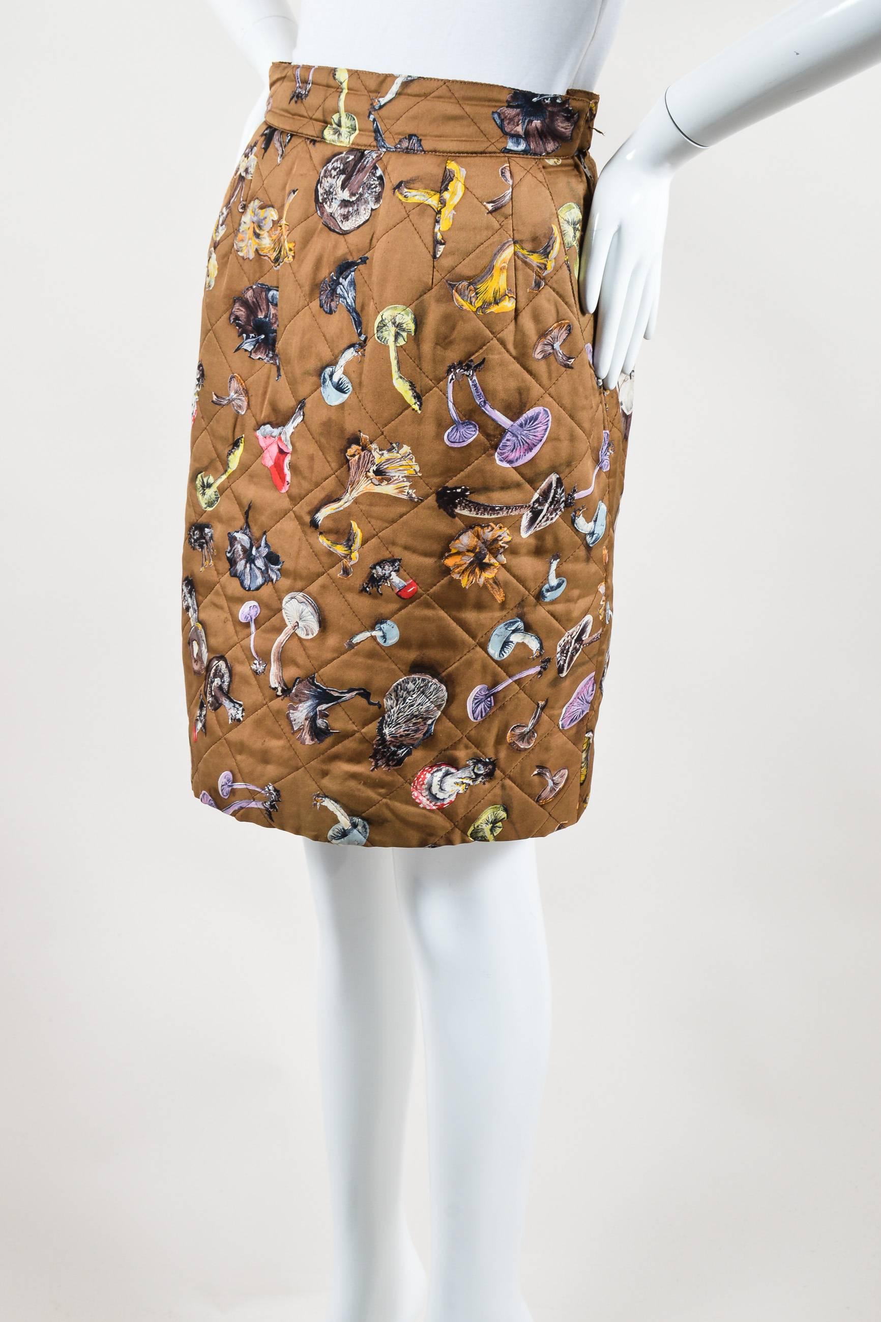 Unique versatile skirt that can be dressed up or down. Silk twill knit. Hits at knees. Diamond-quilted stitching. Multicolor mushroom print. Side slit pockets. Hidden side zip closure with hook-and-eye closure. Lined.

Condition details: