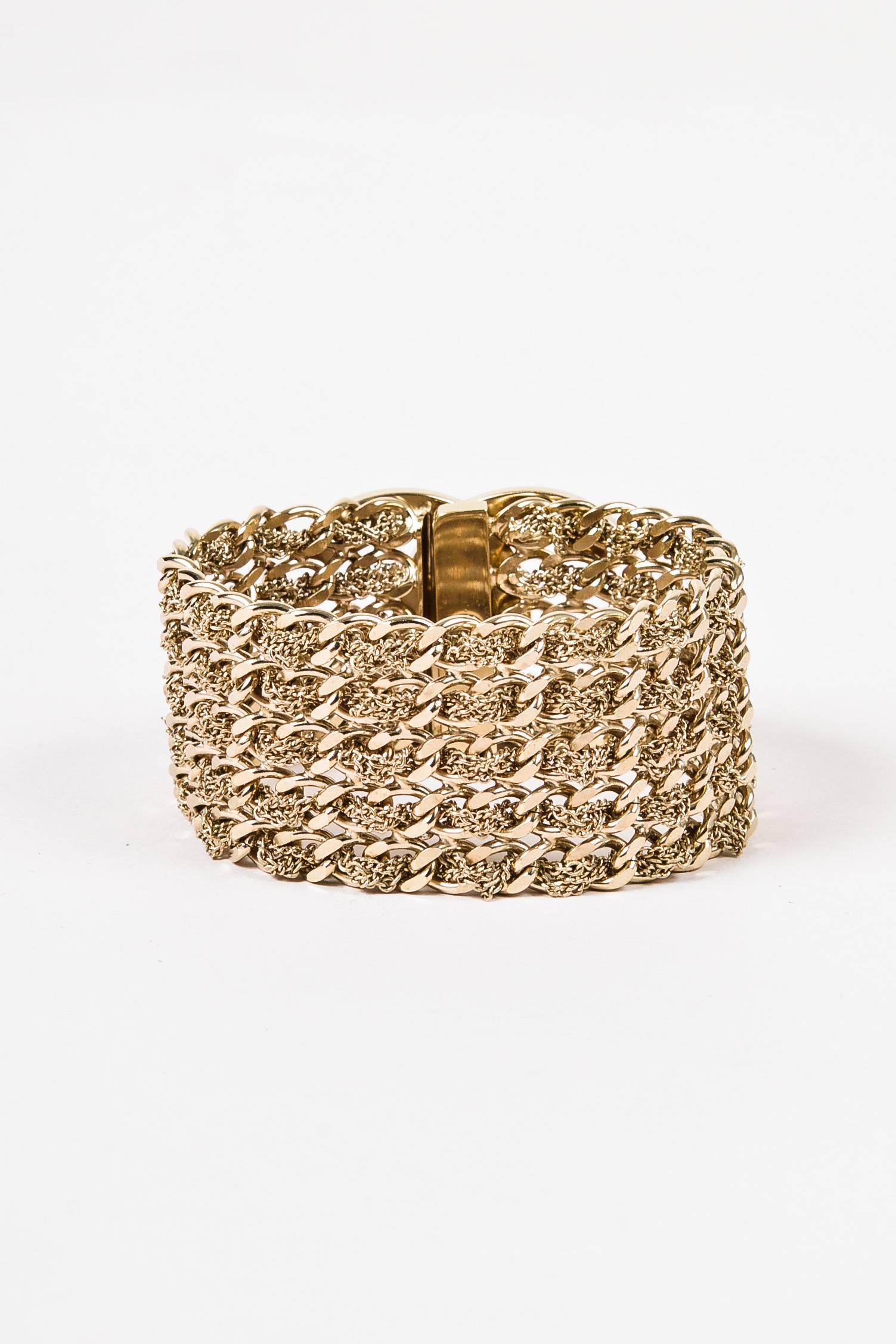 Chanel 2012 Collection Gold Tone Multistrand 'CC' Turn Lock Bracelet Size M In Excellent Condition In Chicago, IL