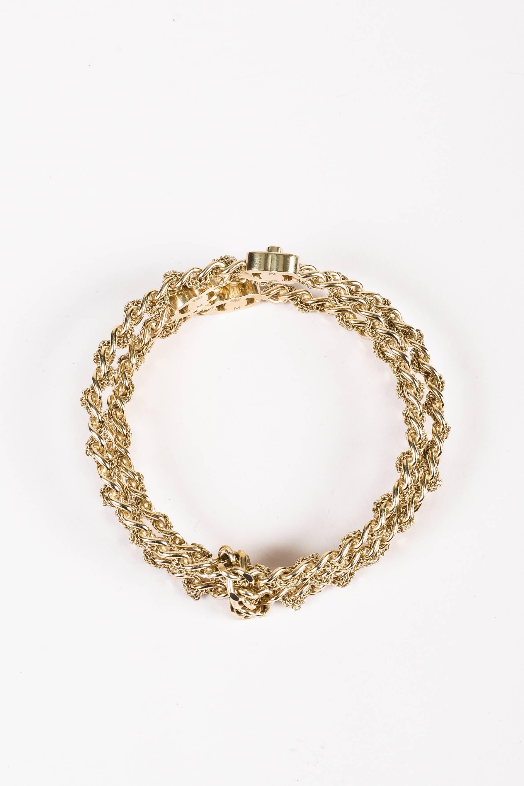 Comes in dust bag. Ultra chic bangle bracelet set from the 2012 Spring Collection. A rare collector's item, this piece features signature Chanel elements & an understated, yet timeless design. Gold-tone metal. Multiple, dainty chains woven