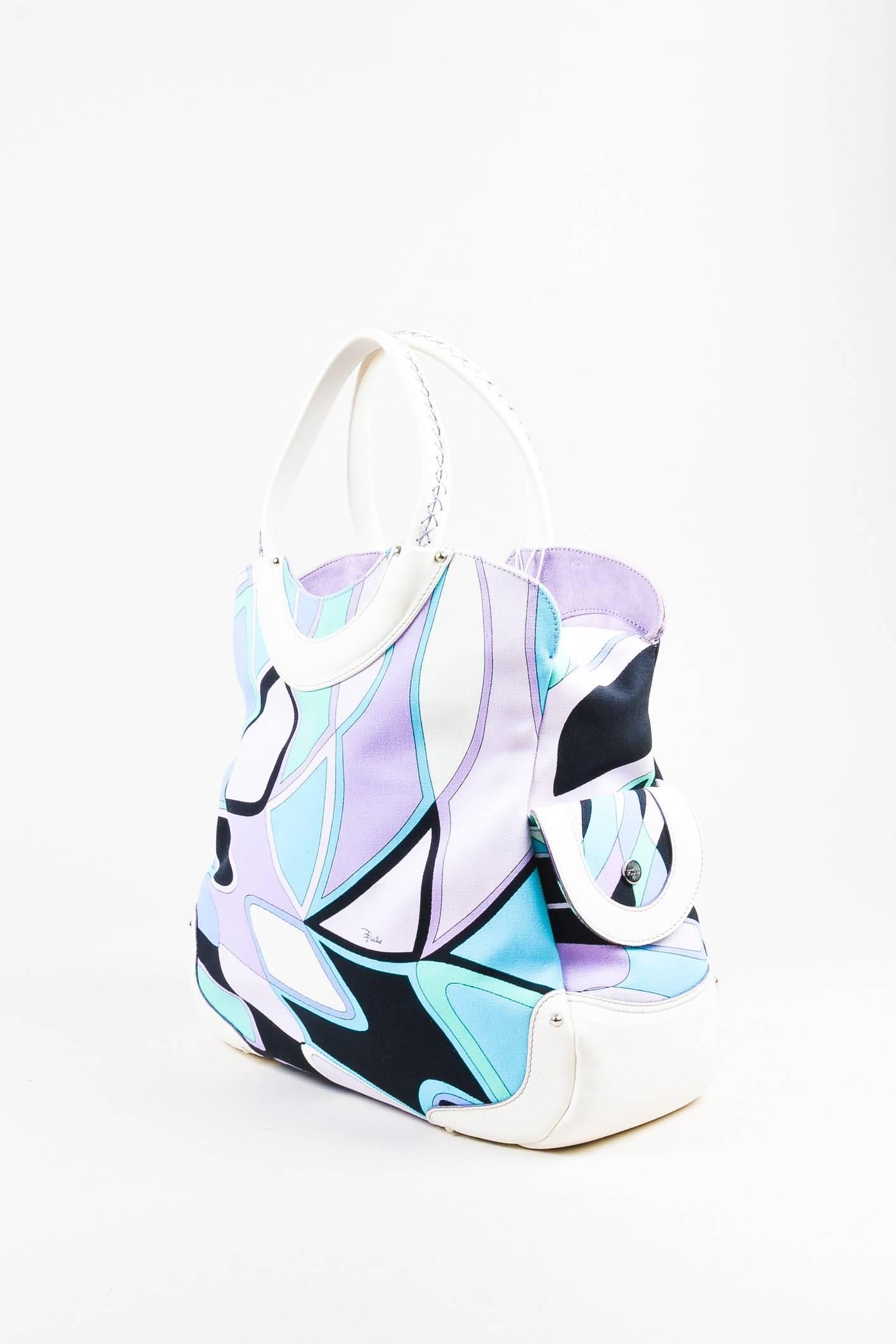 Made In: Italy

Fabric Content: Cotton; Trim: Deer, Kidskin; Lining: Polyester

Item Specifics & Details: Comes with dust bag. Multicolor abstract printed handbag with front pockets. Two pouch pockets, top two flaps are decorative. Purple suede