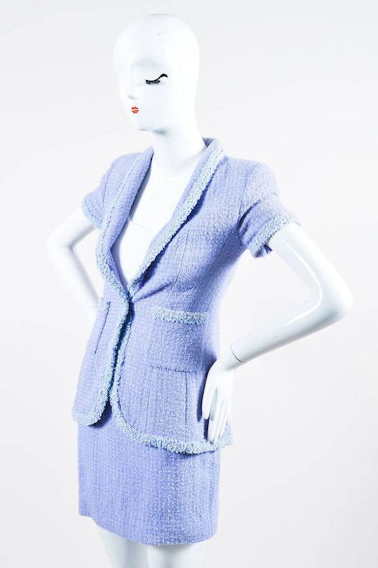 From the 1995 Spring collection. Beautiful pastel skirt suit. Periwinkle and white wool-blend tweed with silver metallic threading throughout. Yellow sequin and textured ribbon trim throughout jacket. Narrow shawl collar. Gold-tone 'CC' logo single