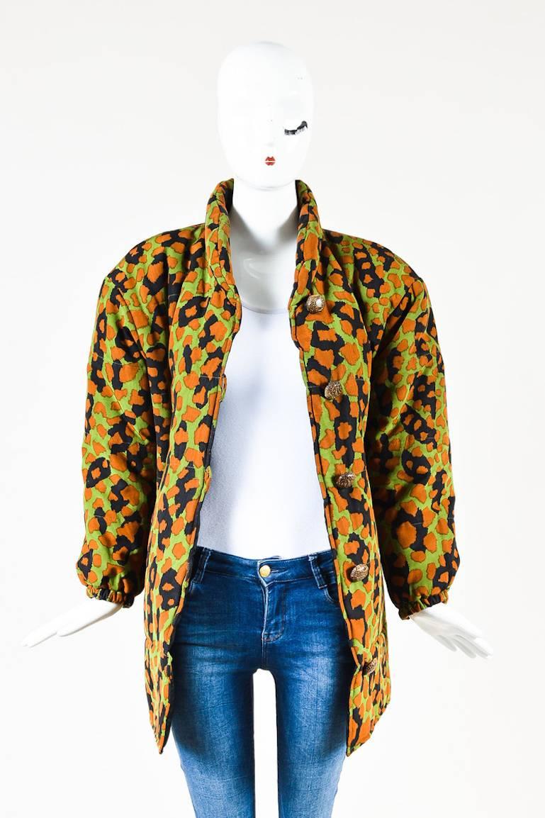 Vintage Yves Saint Laurent Rive Gauche puffer coat designed with  an all over print and wood button closures. Lined.

Additional measurement: Shoulder -to- Shoulder 21