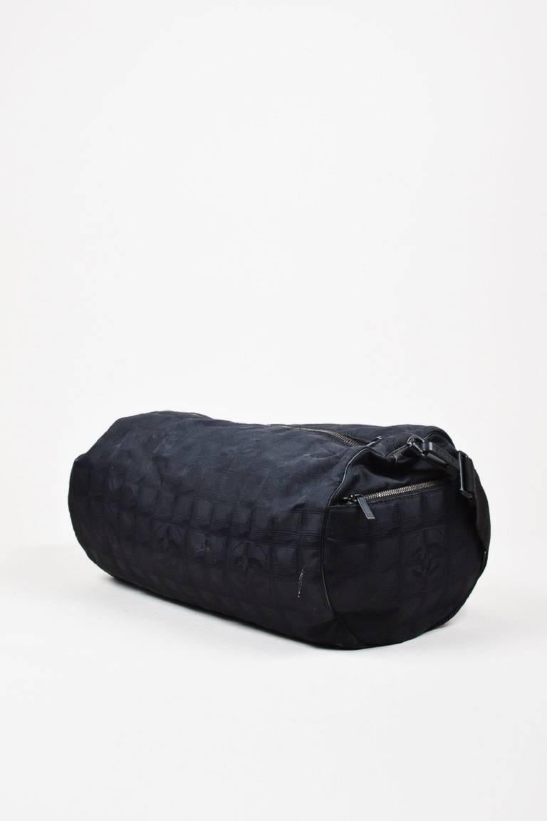 Color: Black,
Style: Travel Line Duffle
Made In: Italy
Fabric Content: Nylon, Leather; Lining: Textile

Item Specifics & Details: This bag is perfect to pack for the gym. Black nylon 'CC' printed "Travel Line Duffle" bag from
