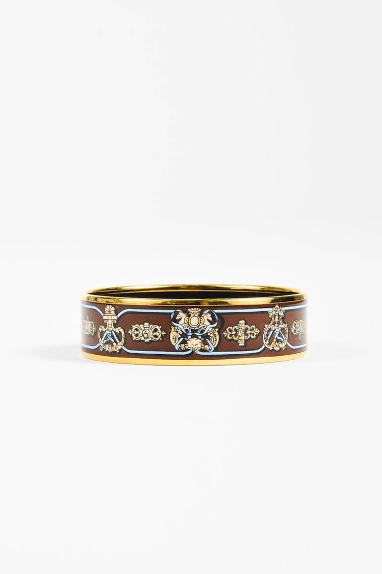 Comes in a pouch. Detailed with luxe gold plating, this round bangle features a multicolor enamel print.

Additional measurement: Top Opening Diameter 2.5
