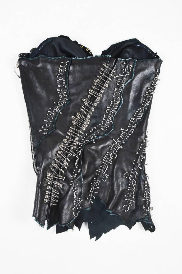 Size: 36
Color: Black,Silver,
Made In: France
Fabric Content: Lamb Leather

Item Specifics & Details: Retails for over $10,000. Black lamskin leather, sleeveless, strapless corset top by Balmain. Leather has worn and ripped edges. Features