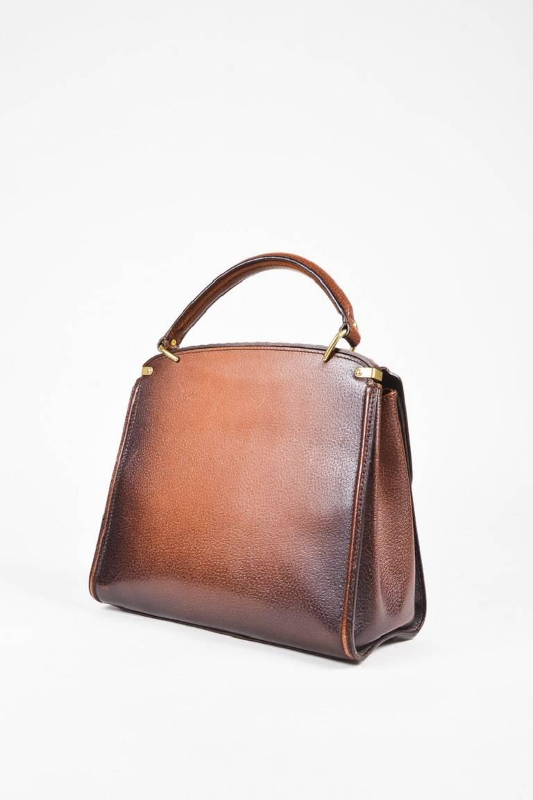 Color: Brown,
Made In: Italy
Fabric Content: Leather, Wood; Pocket Lining: Textile

Item Specifics & Details: Retails at $4,500. Brown grained ombre leather structured bag from Gucci circa 1970's. Front flap 
with a gold-tone turn lock closure.
