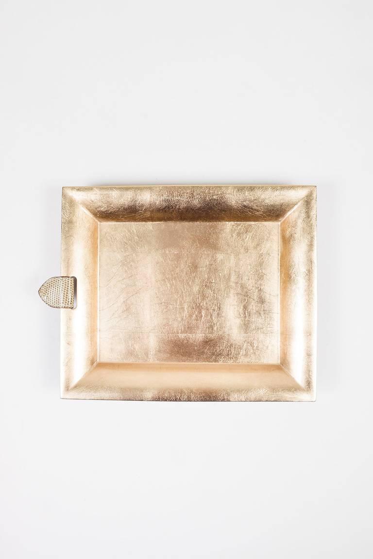 Color: Gold,Metallic,Moongold
Made In: Vietnam
Fabric Content: Lacquer Tray, Genuine Lizard Tab

Item Specifics & Details: Beautifully constructed tray to add a sleek touch to your home decor. Bold metallic gold-tone exterior. High gloss finish.
