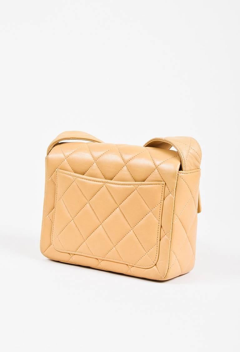 Color: Beige,Gold,
Made In: France
Fabric Content: Exterior: Lambskin Leather; Interior: Lambskin Leather

Item Specifics & Details: Chic bag that oozes classic Chanel style. Lambskin leather construction. Gold-tone hardware. Diamond quilted