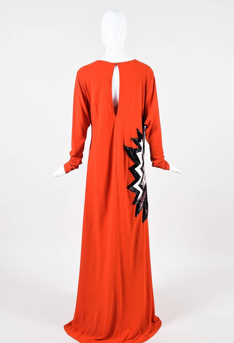 Size: 44
Color: Black,Orange,White,
Made In: Italy
Fabric Content: Exterior: Nylon; Lining: Viscose

Item Specifics & Details: Retailed for $5,950. A bold evening look, this dress features a round neck, knit construction, long sleeves, a