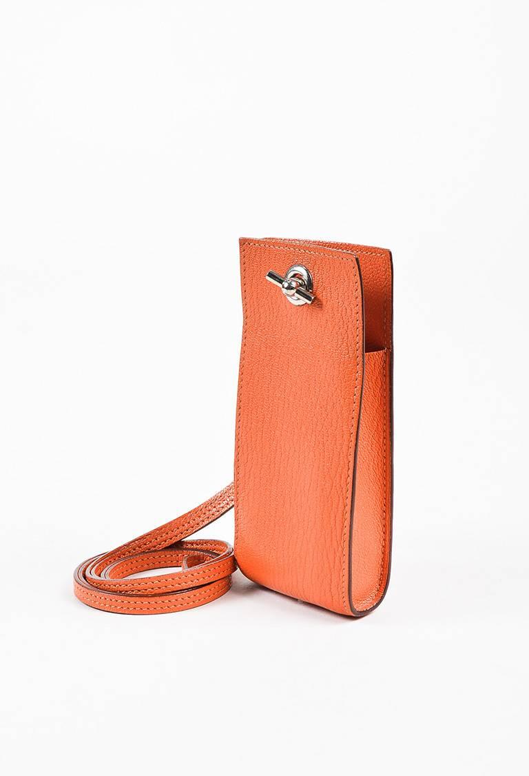 Color: Orange,
Style: Planet
Made In: France
Fabric Content: Chevre Mysore Leather

Item Specifics & Details: Supple Chevre Mysore leather construction. Silver-tone hardware. Flat shoulder strap; removable with toggle closure. Blind stamp: H. Circa