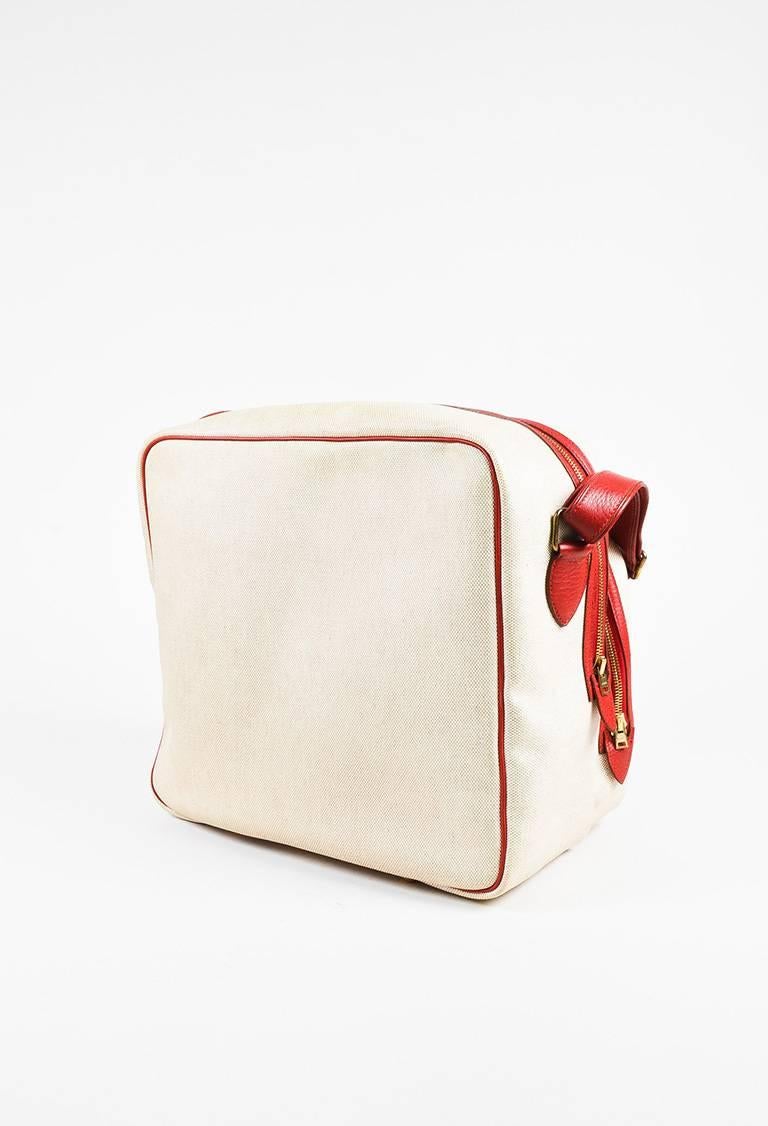 Color: Beige,Red,
Style: Caleche Express
Made In: France
Fabric Content: Exterior: Canvas, Leather; Lining: Textile

Item Specifics & Details: The 