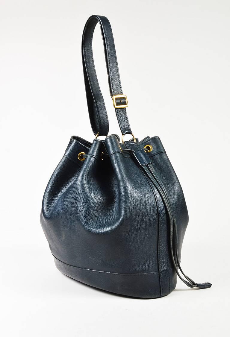 Color: Blue,Gold,
Style: Market
Made In: France
Fabric Content: Leather

Item Specifics & Details: Vintage bucket bag with classic style. Durable saffiano leather construction. Gold-tone hardware. Adjustable top shoulder strap. Top drawstring