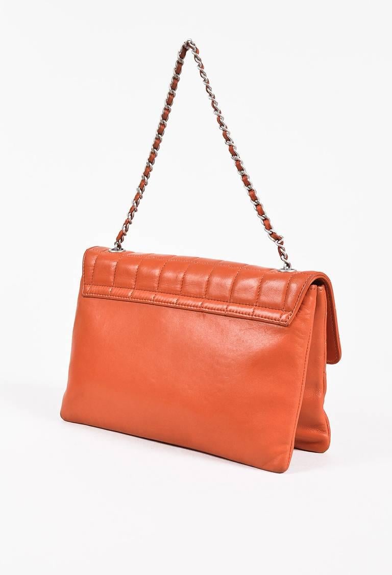 Color: Orange,Silver,
Made In: France
Fabric Content: Leather; Lining: Textile

Item Specifics & Details: Orange lambskin leather chocolate bar 