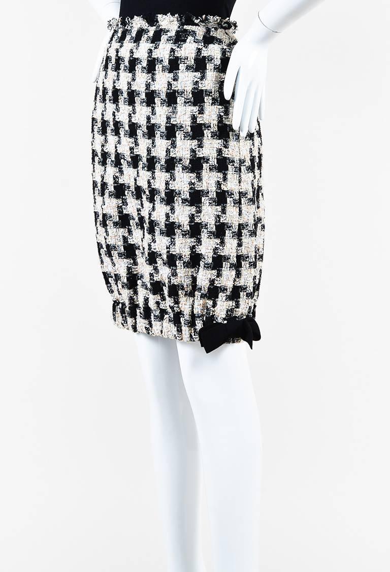 Size: 38 (FR)
Color: Black,Cream,
Made In: France
Fabric Content: Cotton, Polyester, Nylon; Lining: Silk
Item Specifics & Details: From the fall 2004 collection. Cotton construction. Tweed weaving. Multicolored checkered pattern throughout. Banded