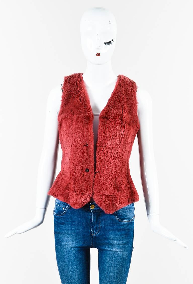Size: 40 (FR)
Color: Pink,
Made In: France
Fabric Content: Genuine Rabbit Fur; Wool, Nylon; Silk, Lycra

Item Specifics & Details: Vintage genuine rabbit fur and wool blend knit sleeveless vest from Chanel Boutique circa Fall 1997. V-cut neckline.