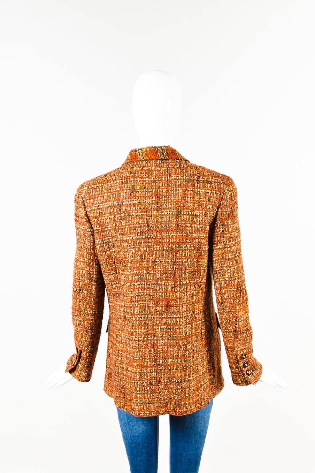 Size: 42
Color: Burnt Orange, Beige, Multicolor
Made In: France
Fabric Content: Exterior: Wool, Acrylic; Lining: Silk

Item Specifics & Details: Features a multicolored tweed construction, a notched lapel, transparent 'CC' buttons at the front and