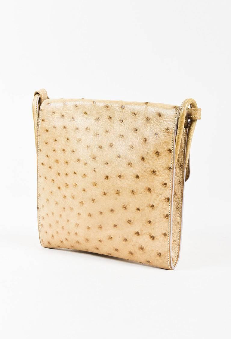 Color: Beige,
Made In: France
Fabric Content: Genuine Ostrich; Lining: Leather

Item Specifics & Details: Vintage beige genuine ostrich shoulder bag from Hermes. Single strap for wear. Front flap with a concealed gold-tone snap