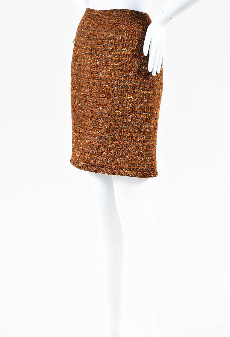 Size: 36 (FR)
Color: Brown,Multicolor,
Made In: France
Fabric Content: Exterior: Wool; Lining: Silk
Item Specifics & Details: Wool tweed pencil skirt featuring a buttoned back vent and a center back zip closure. Lined. From the autumn 1998