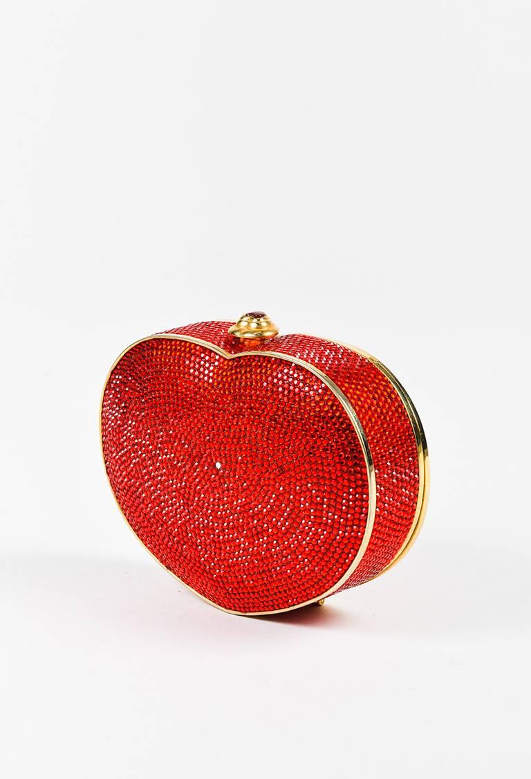 Color: Red,
Made In: Unknown.
Fabric Content: Exterior: Crystal, Metal; Interior: Leather

Item Specifics & Details: Gold-tone hardware. Heart-shaped metal frame. Brilliant crystal embellishment throughout. Chain shoulder strap; can be hidden