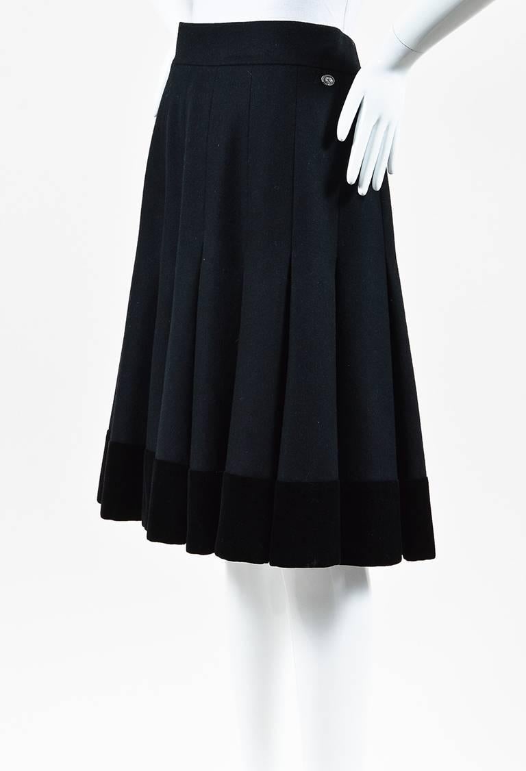 Size: 44 (FR)
Color: Black,
Made In: France
Fabric Content: Cotton, Wool, Alpaca; Lining: Silk

Item Specifics & Details: From the Pre-Fall 2014 Paris-Dallas Collection by Chanel. Pleated flare midi skirt constructed of a wool/alpaca blend. Features