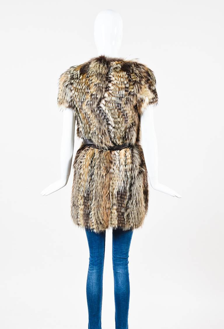 Size: 38 (IT)
Color: Brown,Cream,
Made In: France
Fabric Content: Badger Fur, Fox Fur, Racoon Fur

Item Specifics & Details: RUNWAY COUTURE belted outerwear vest by Prada. Genuine fox, raccoon, and badger fur construction. Designed with a camouflage