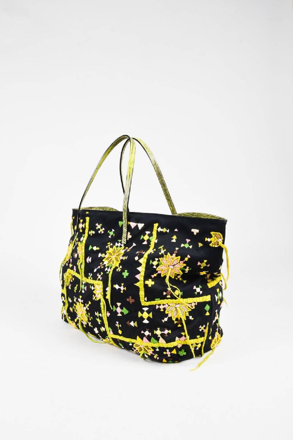 Color: Black,Green,Yellow,
Made In: Italy
Fabric Content: Textile; Trim: Genuine Lizard

Item Specifics & Details: Retails at $895. This limited edition Fendi tote bag is perfect for vacation or everyday use. Constructed of black fabric. Features