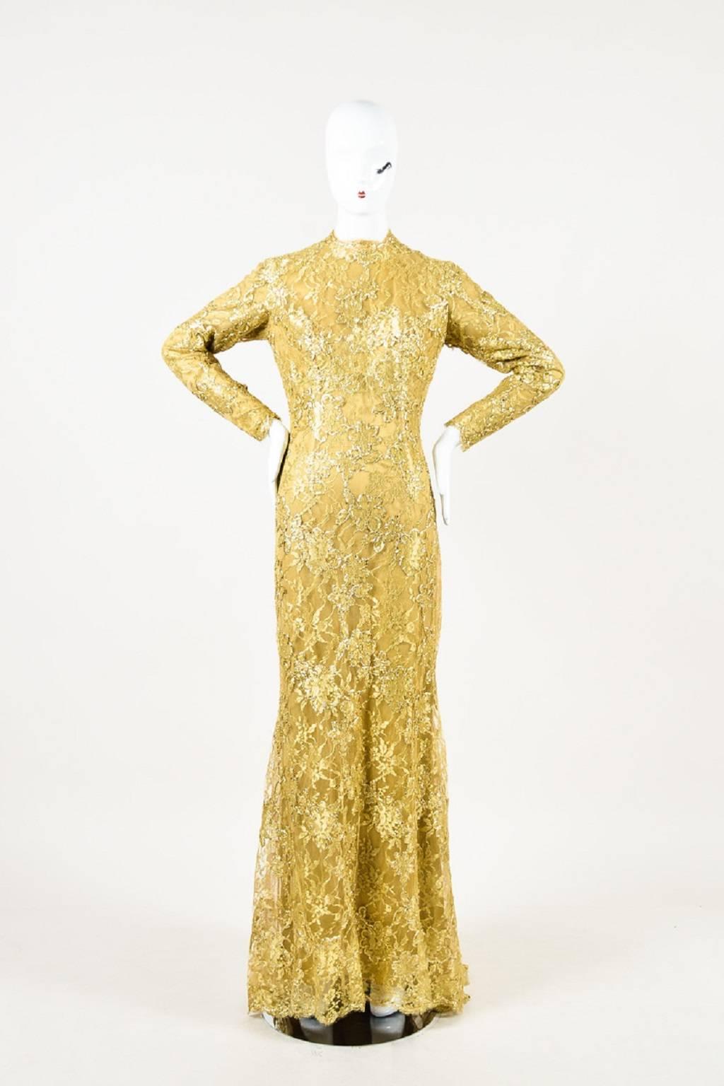 Size: Unknown, please refer to measurements.
Color: Gold Metallic
Made In: Unknown
Fabric Content: Unknown, appears to be some type of synthetic shell, silk lining

Item Specifics & Details: Comes in garment bag. Retails at $16,000. Gorgeous and