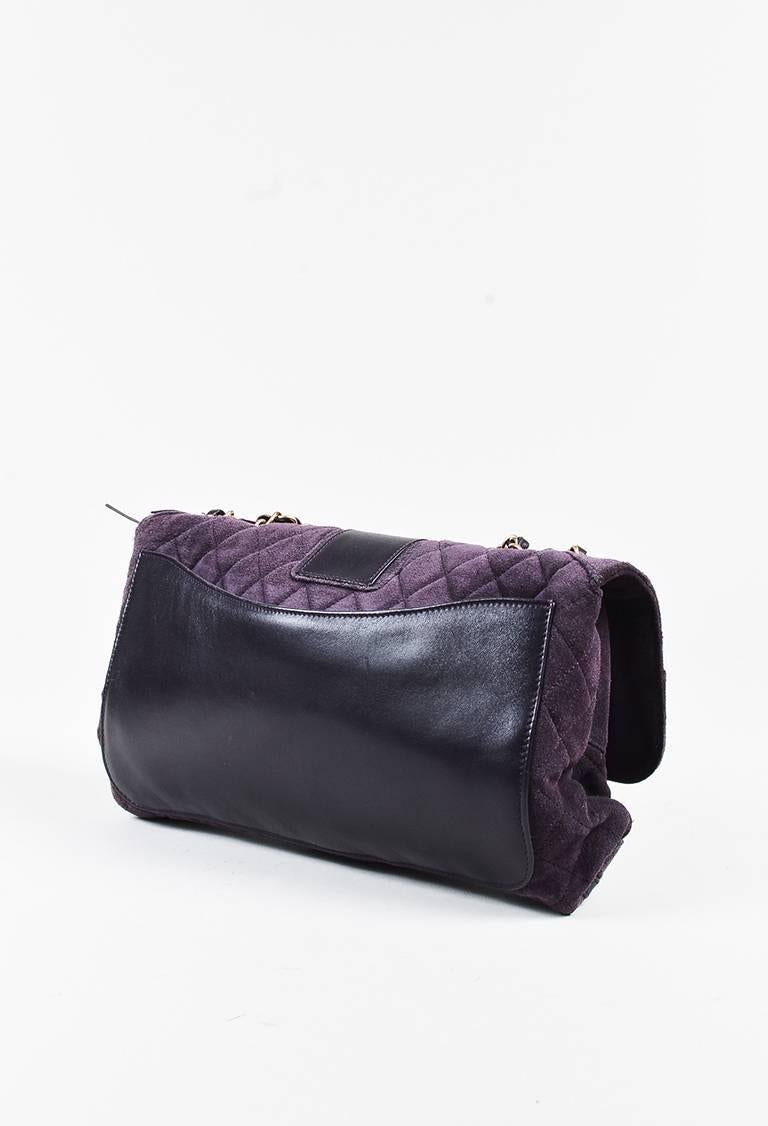 Color: Purple,
Made In: Italy
Fabric Content: Exterior: Suede; Interior: Textile
Item Specifics & Details: Unique shoulder bag from across the pond. Pre-fall 2008. Brushed suede construction. Smooth leather trimmings. British 
