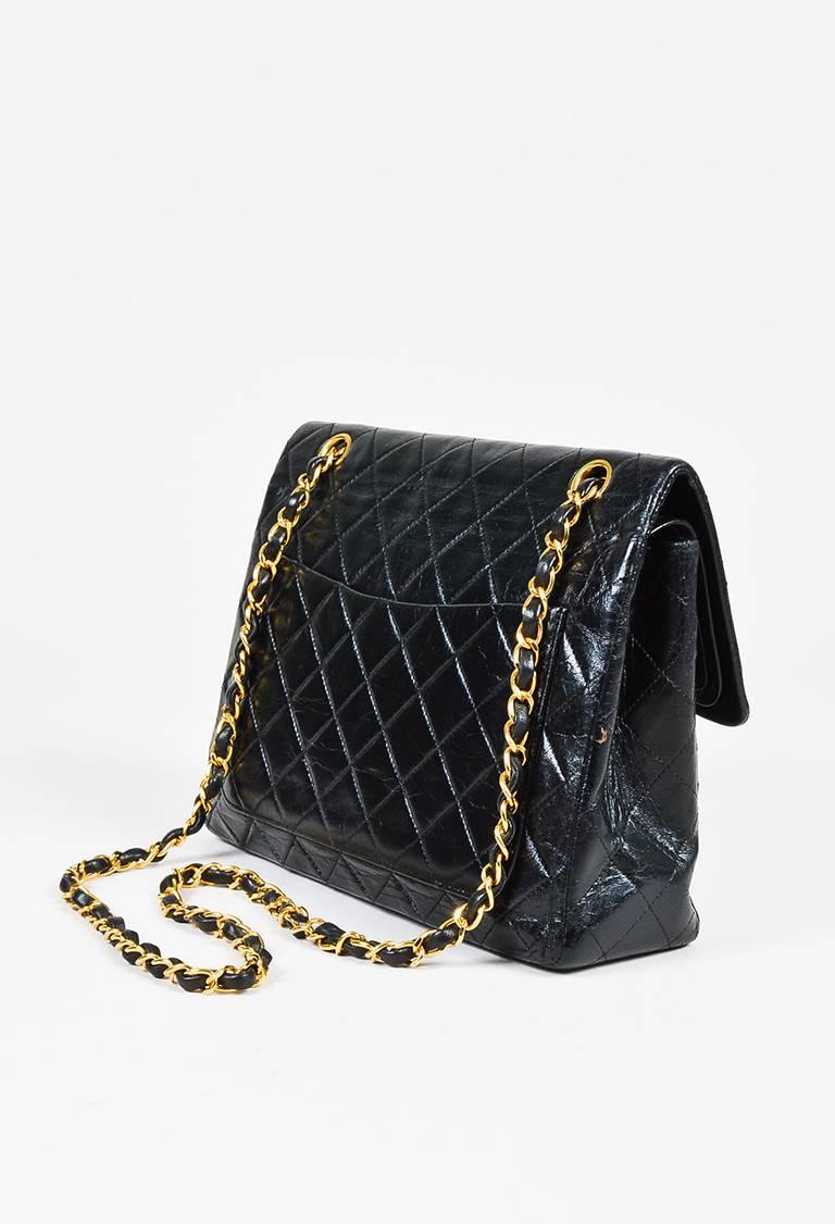 Color: Black,Gold,
Made In: Unknown
Fabric Content: Leather
Item Specifics & Details: Released circa 1986-1988. Vintage bag featuring iconic quilting, a flap front with a 'CC' twist-lock closure, an interior flap with an interlocking 'CC' stitch
